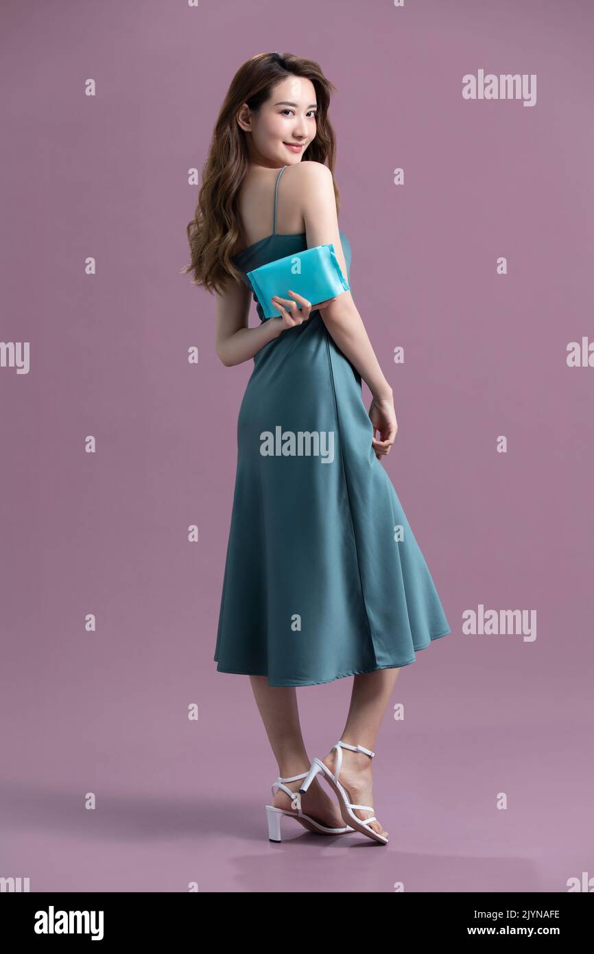 Studio shot of beautiful young Chinese woman Stock Photo - Alamy