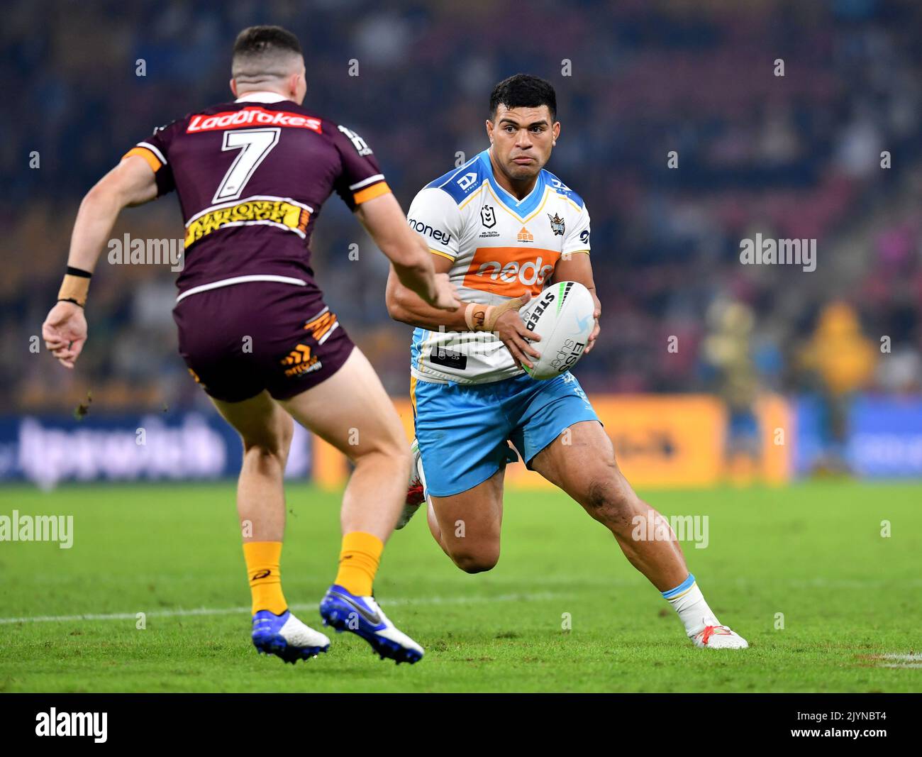 David Fifita (right) of the Titans takes on Tyson Gamble (left) of the Broncos during the Round 8 NRL match between the Gold Coast Titans and the Brisbane Broncos at Suncorp Stadium in Brisbane, Friday, April 30, 2021. (AAP Image/Darren England) NO ARCHIVING, EDITORIAL USE ONLY ** STRICTLY EDITORIAL USE ONLY, NO COMMERCIAL USE, NO BOOKS ** Stock Photo