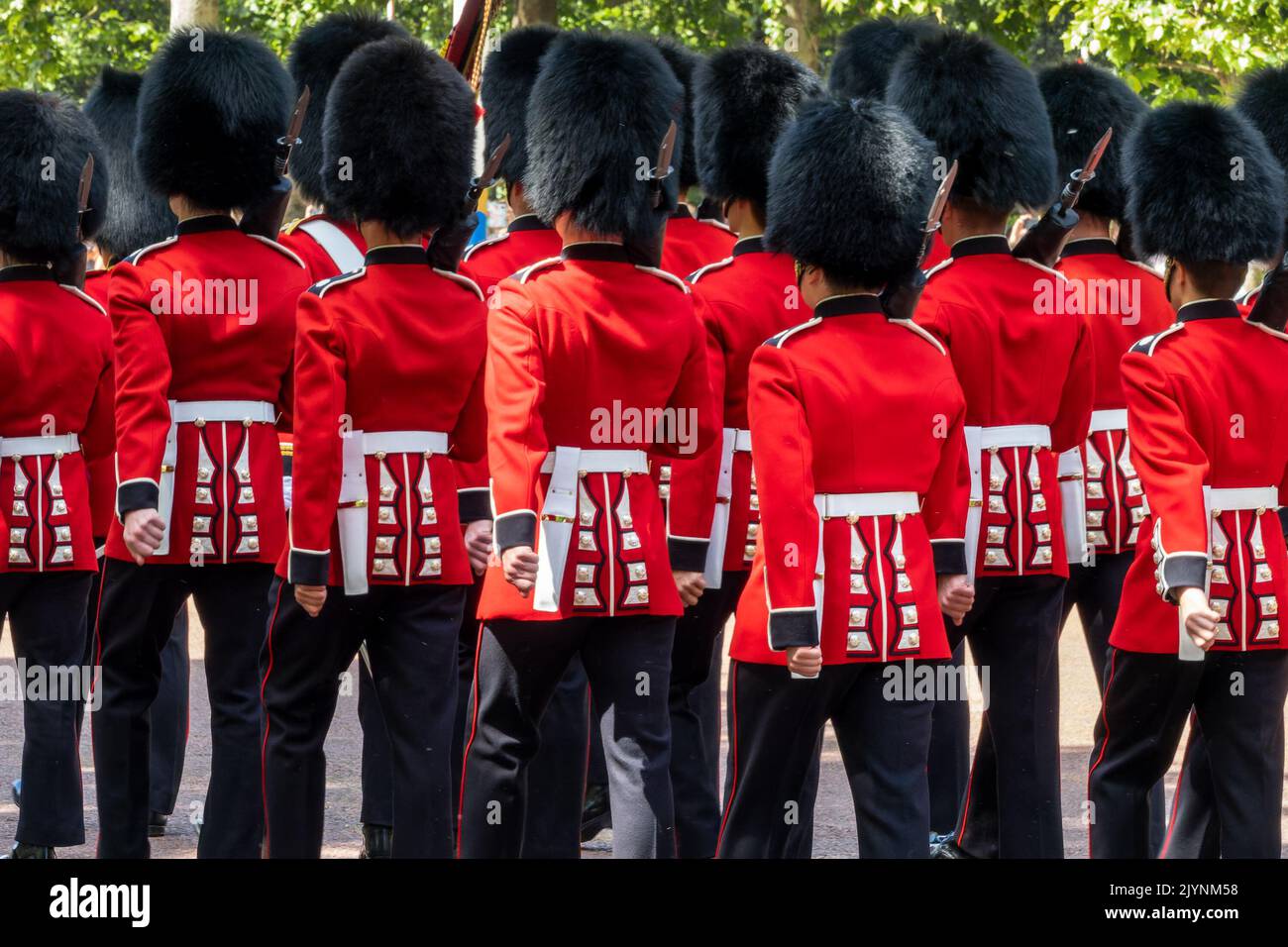 Queen royal british guards in red uniforms during guards changing parade on the Mall in London UK Stock Photo