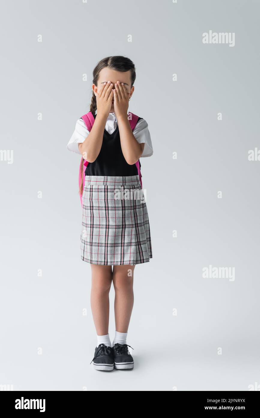School uniform girl full length skirt hi-res stock photography and ...