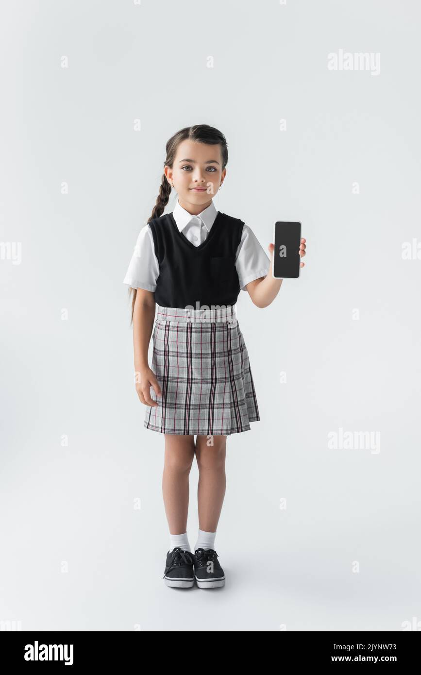 School uniform girl full length skirt hi-res stock photography and ...