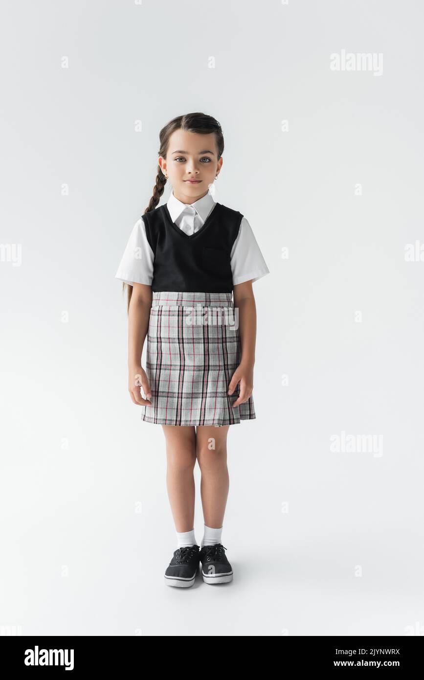 School girl in uniform grey skirt hi-res stock photography and images ...