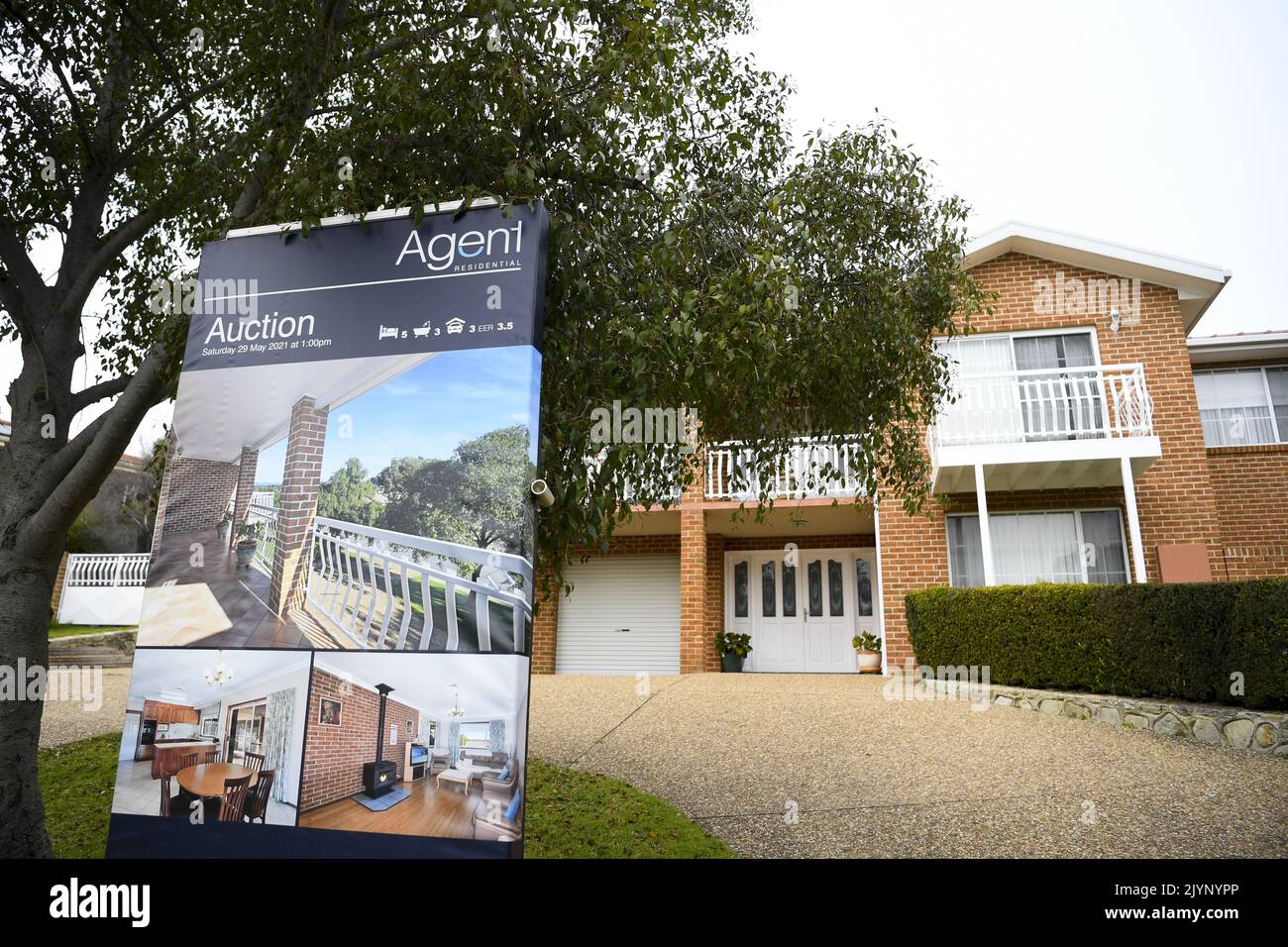 An Auction sign is seen in front of a house in Canberra in Canberra