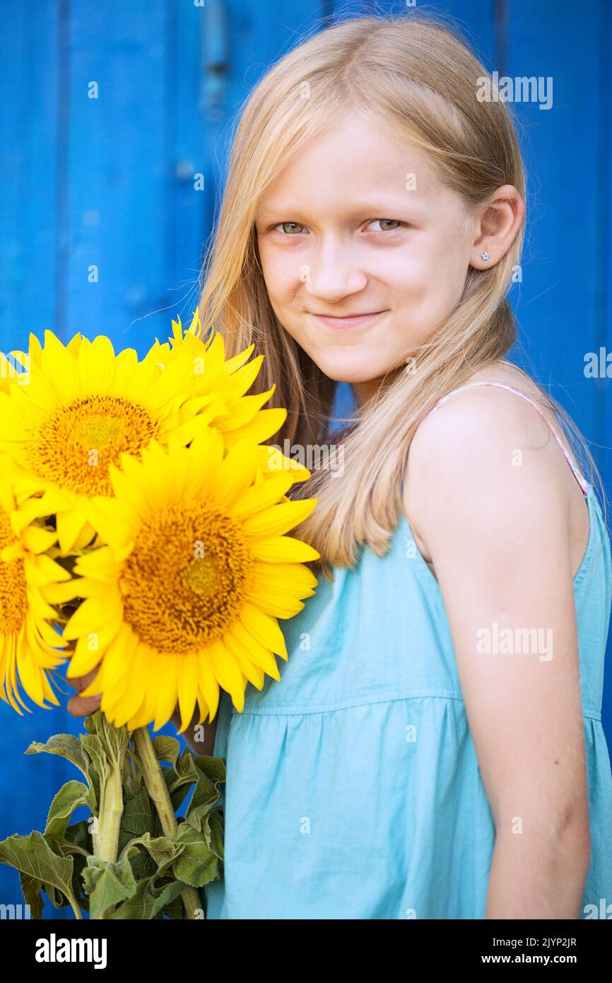 summer - portrait of a little smiling girl with a sunflower Stock Photo ...