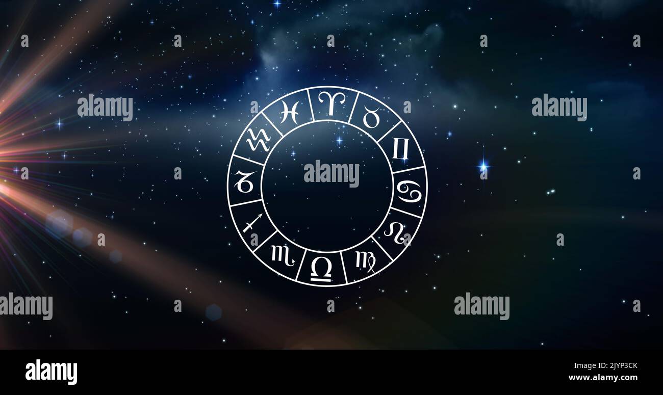 Image of wheel of zodiac signs over shining sun and stars on blue sky Stock Photo
