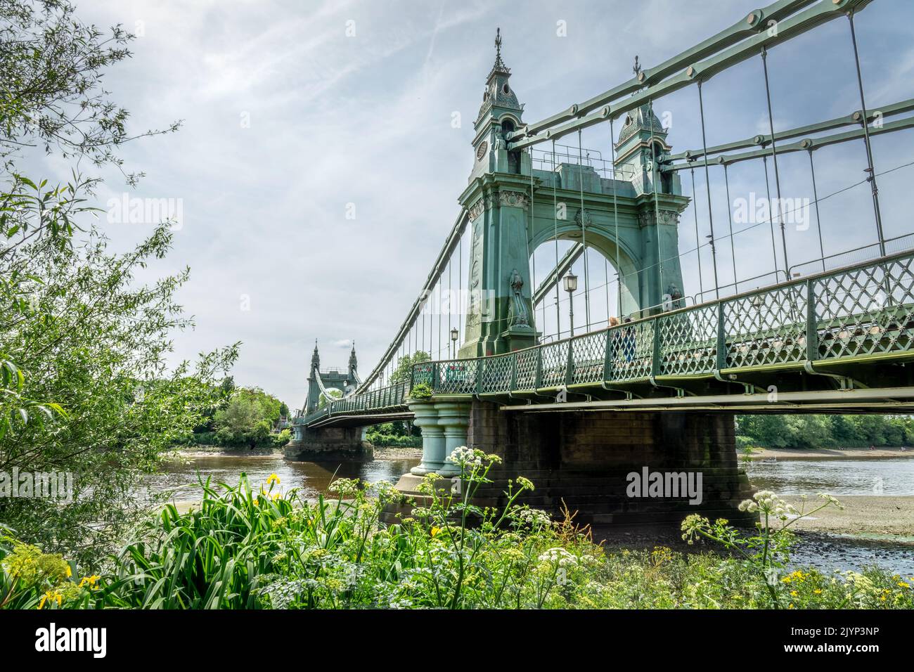 Hammersmith bridge over Thames river in London, UK Stock Photo
