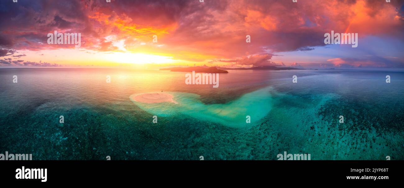 First sunset of the year 2022, a beautiful sunset that occurs just after the passage of storm squalls on the white sand islet of Saziley, Mayotte Stock Photo