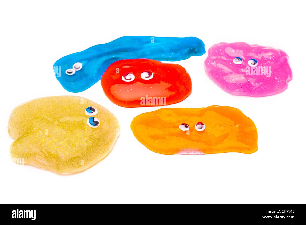 a toy for children mucus and liquid flowing which has eyes on white background Stock Photo