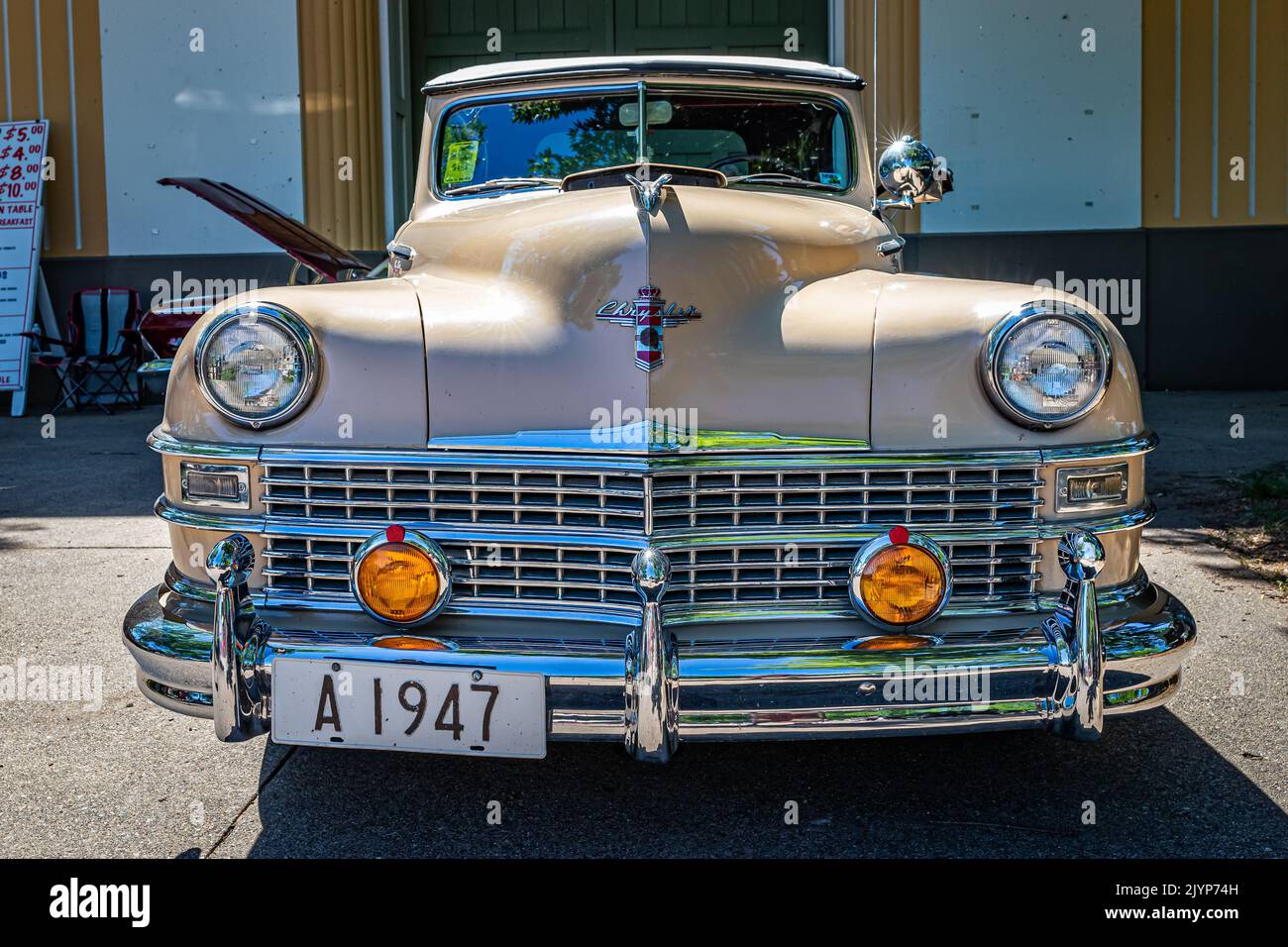 Falcon Heights, MN - June 17, 2022: Low perspective front view of a 1947 Chrysler New Yorker Highlander Convertible at a local car show. Stock Photo