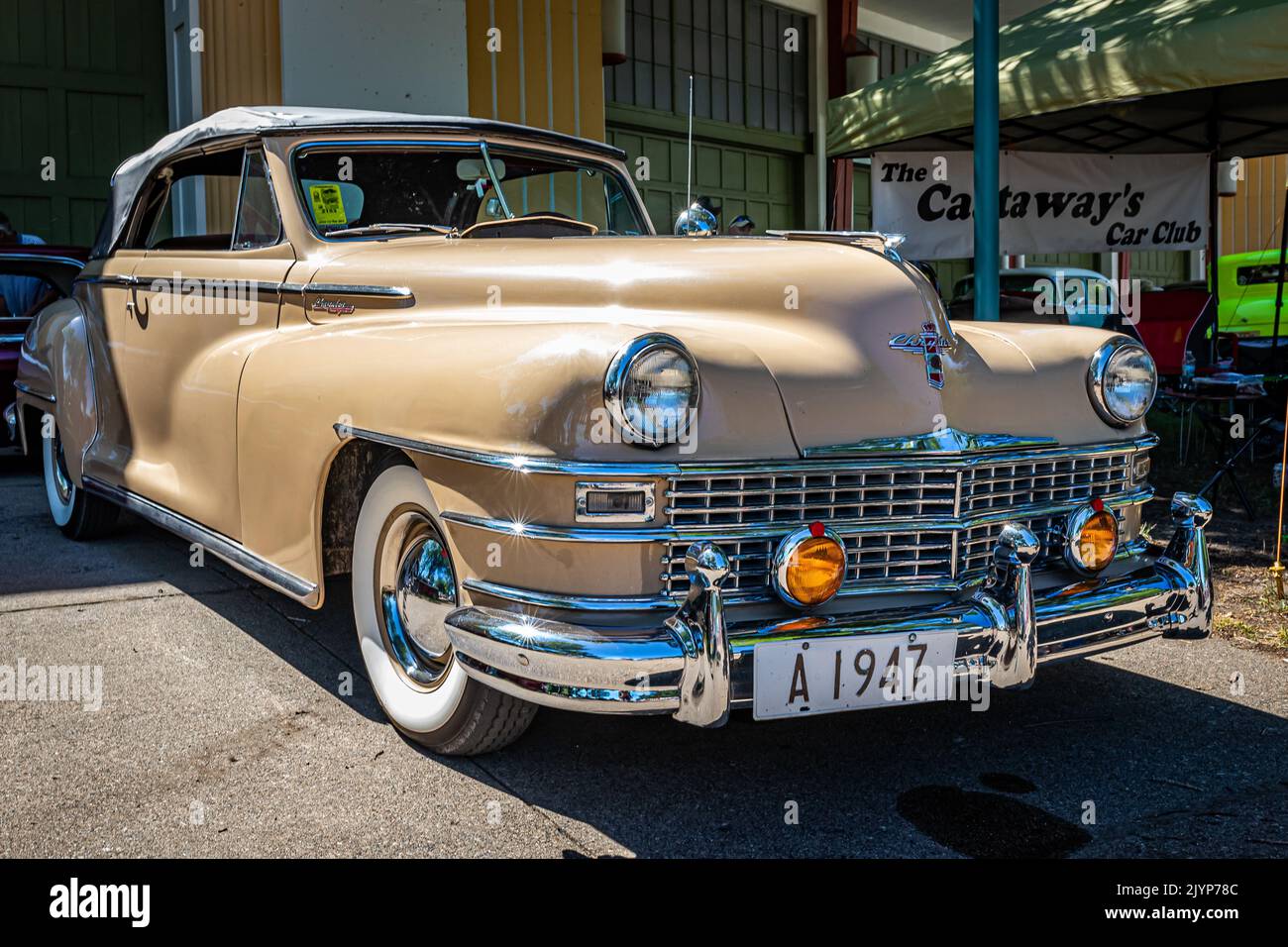 Falcon Heights, MN - June 17, 2022: Low perspective front corner view of a 1947 Chrysler New Yorker Highlander Convertible at a local car show. Stock Photo