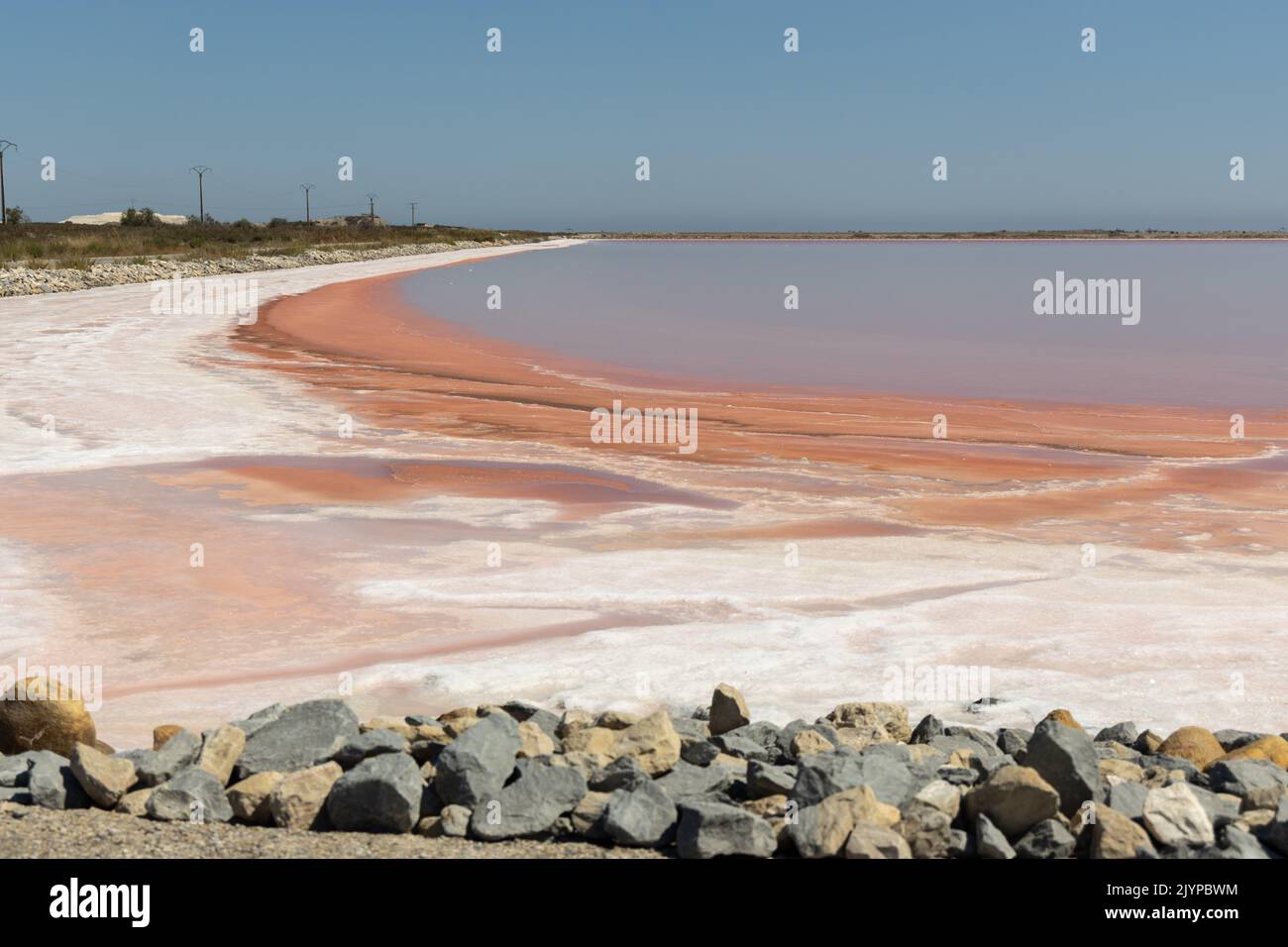 Rose coloured salt lagoons near Aigues Mortes in the Camargue region of South West France Stock Photo