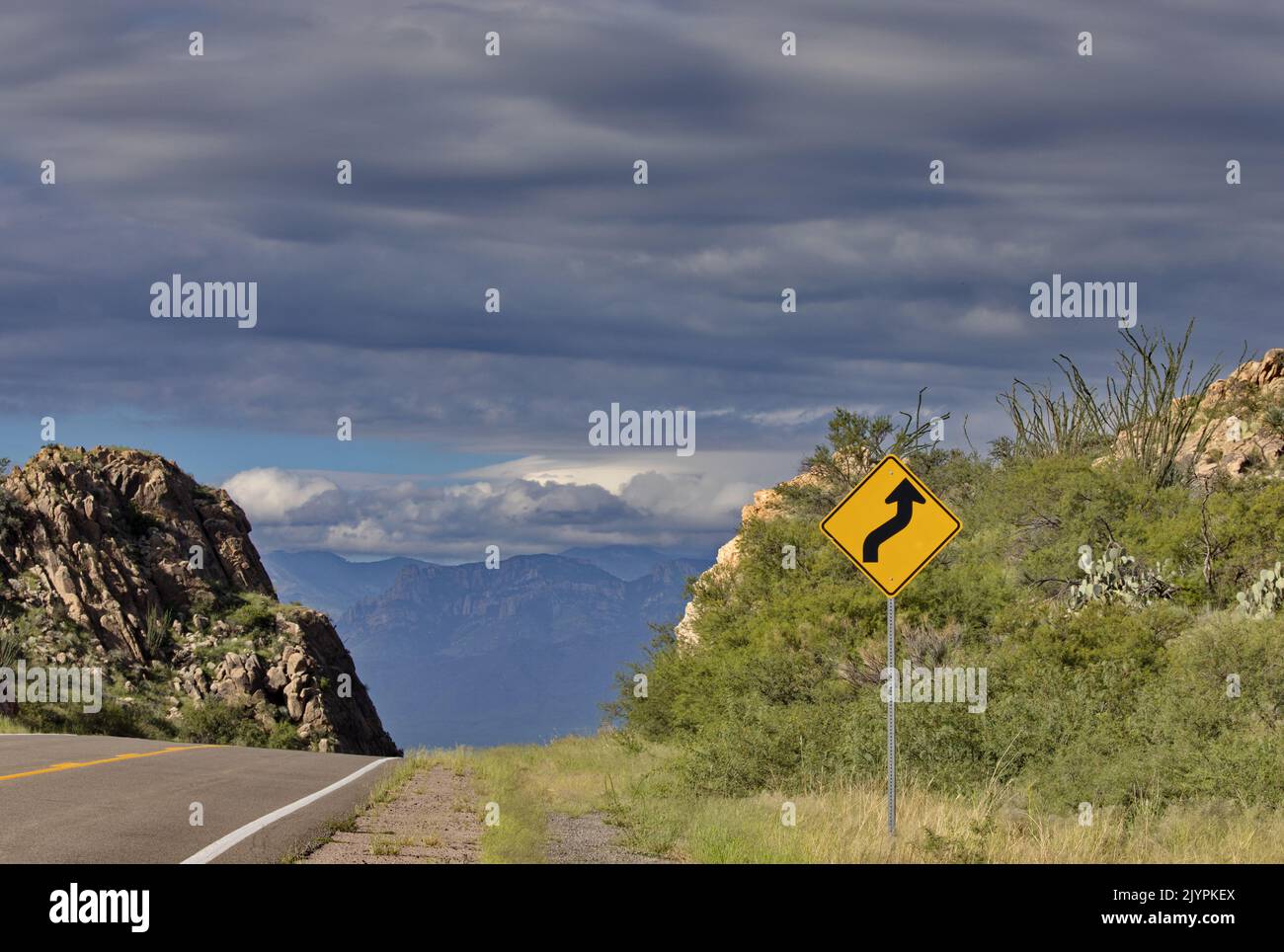 Highway sign humor in road sign seeming to indicate Roadway to Heaven in its upward, skyward pointing arrow on Highway 80 in New Mexico in Chiricahua Stock Photo