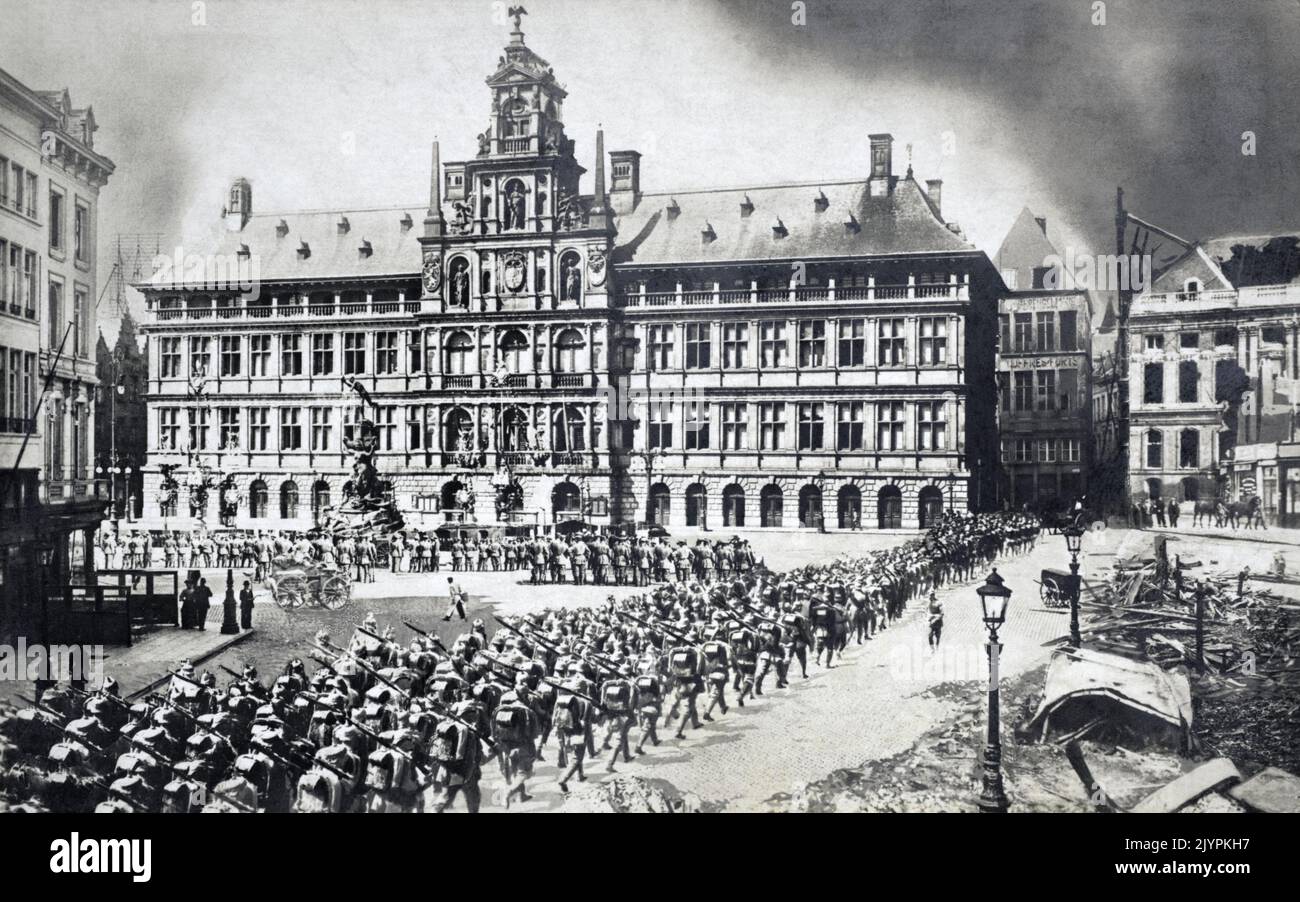 German infantry marching into Antwerp past the City Hall on 9th October 1914, during the early stages of the First World War. Stock Photo