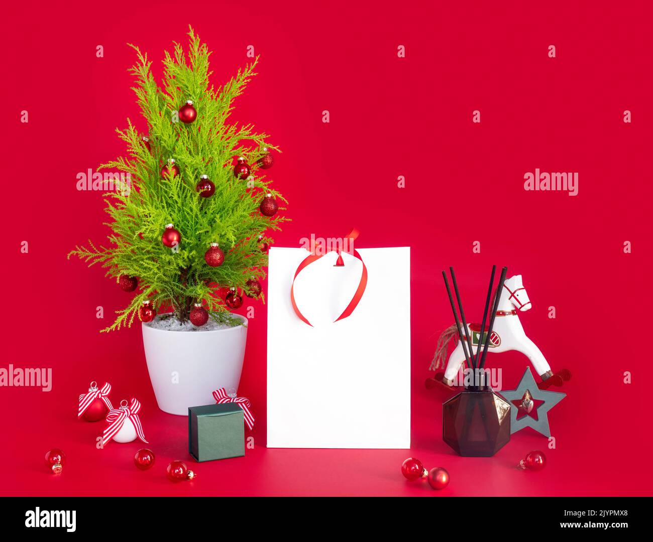 Christmas mockup on red background with New Year's gift and decorative ...