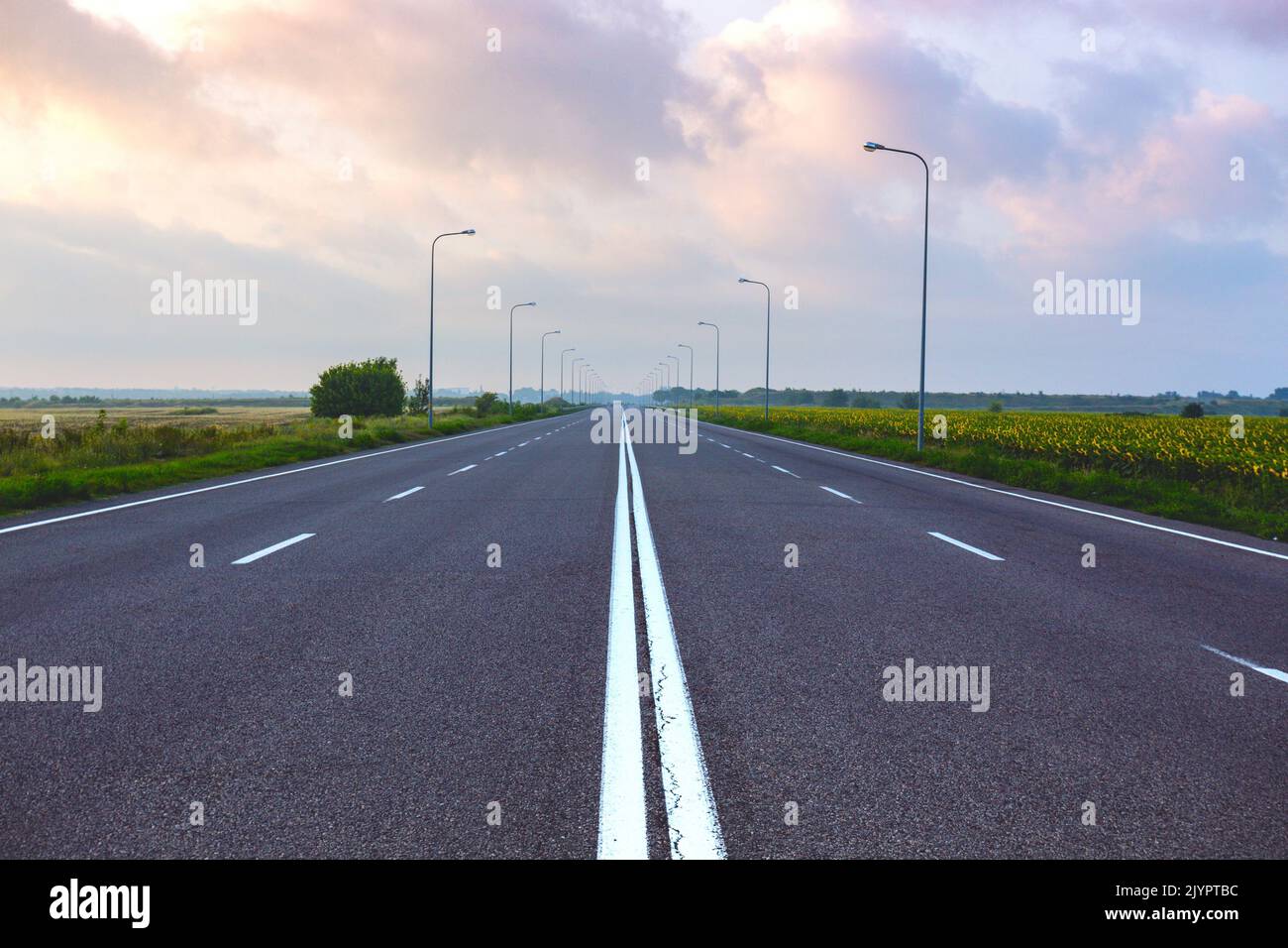 Autobahn. an empty flat road at dawn Stock Photo - Alamy