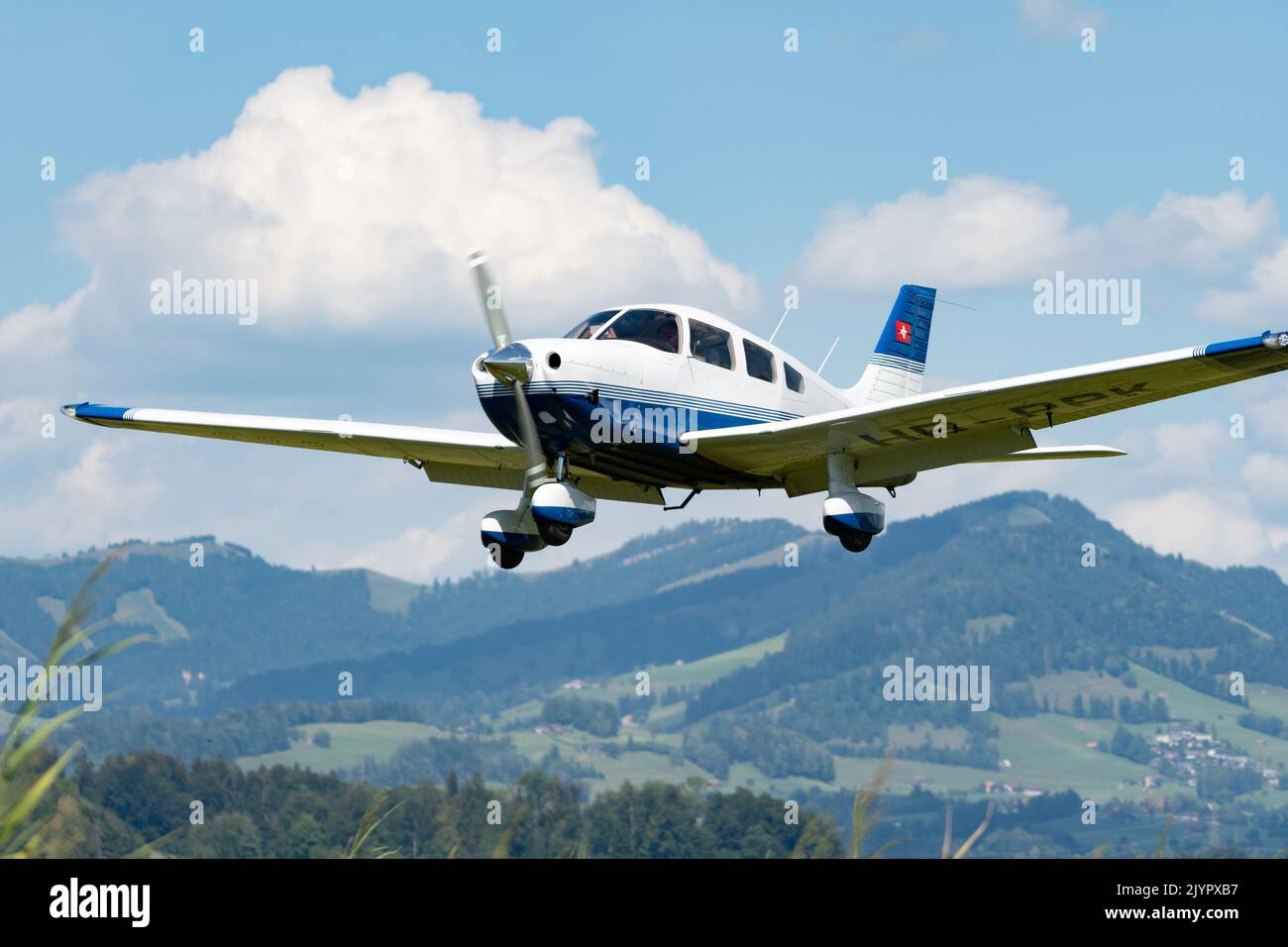Wangen-Lachen, Switzerland, July 31, 2022 Piper PA28-181 Archer III propeller plane is landing on a small airfield Stock Photo