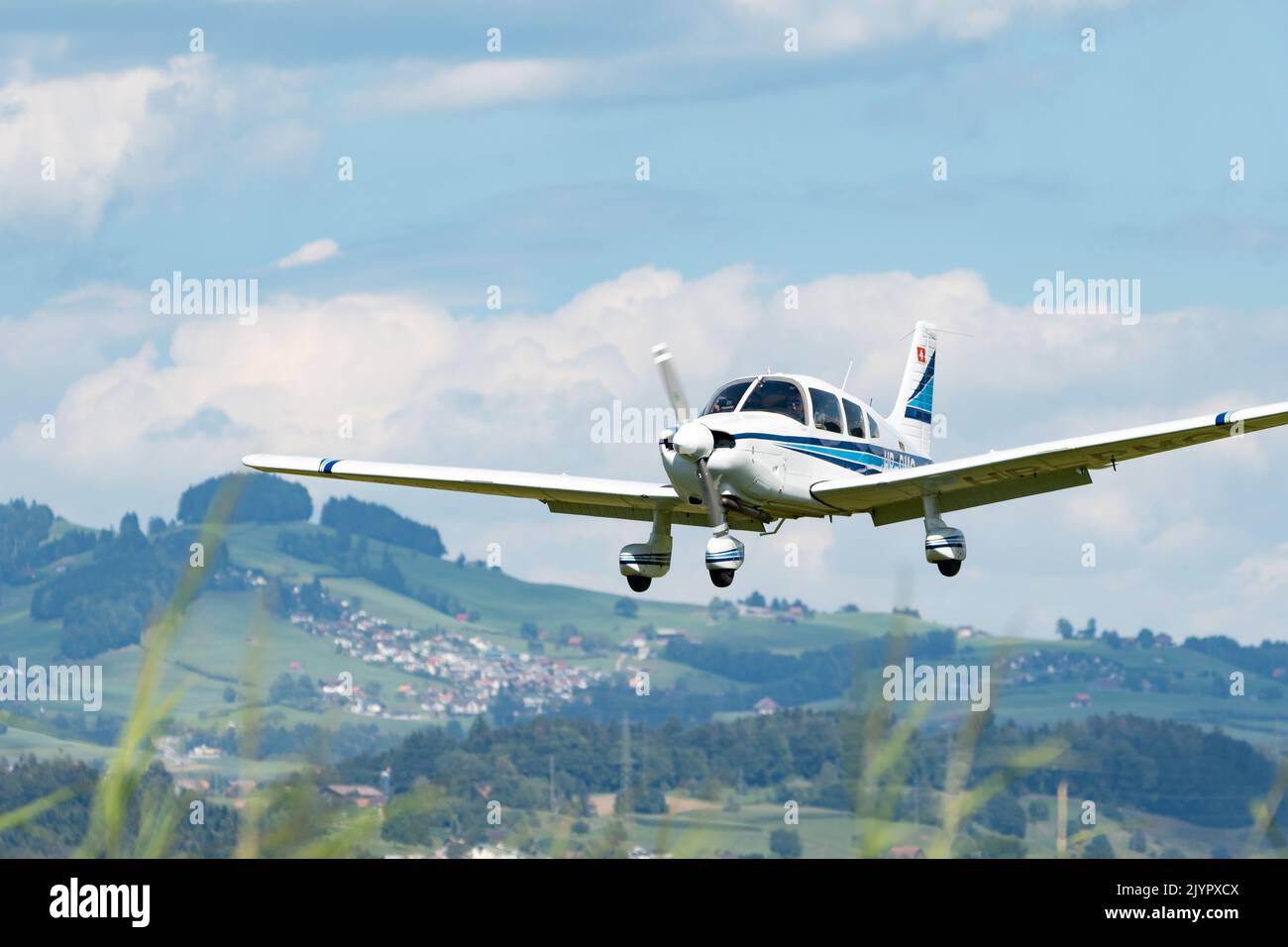 Wangen-Lachen, Switzerland, July 31, 2022 Piper PA28-181 Archer II is landing on a small airfield Stock Photo