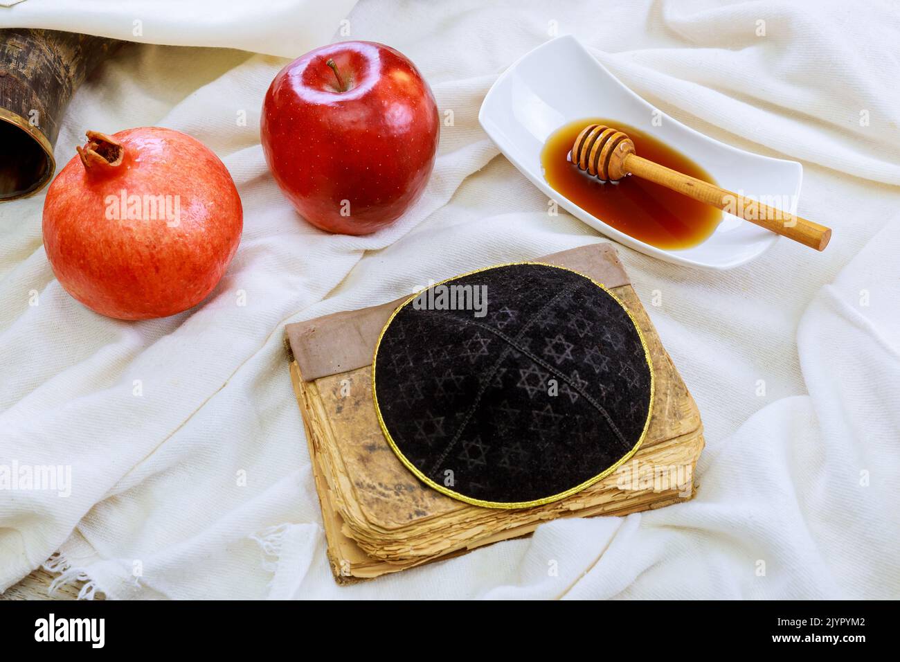 The traditional symbols of the Jewish New Year holiday of Rosh Hashanah ...