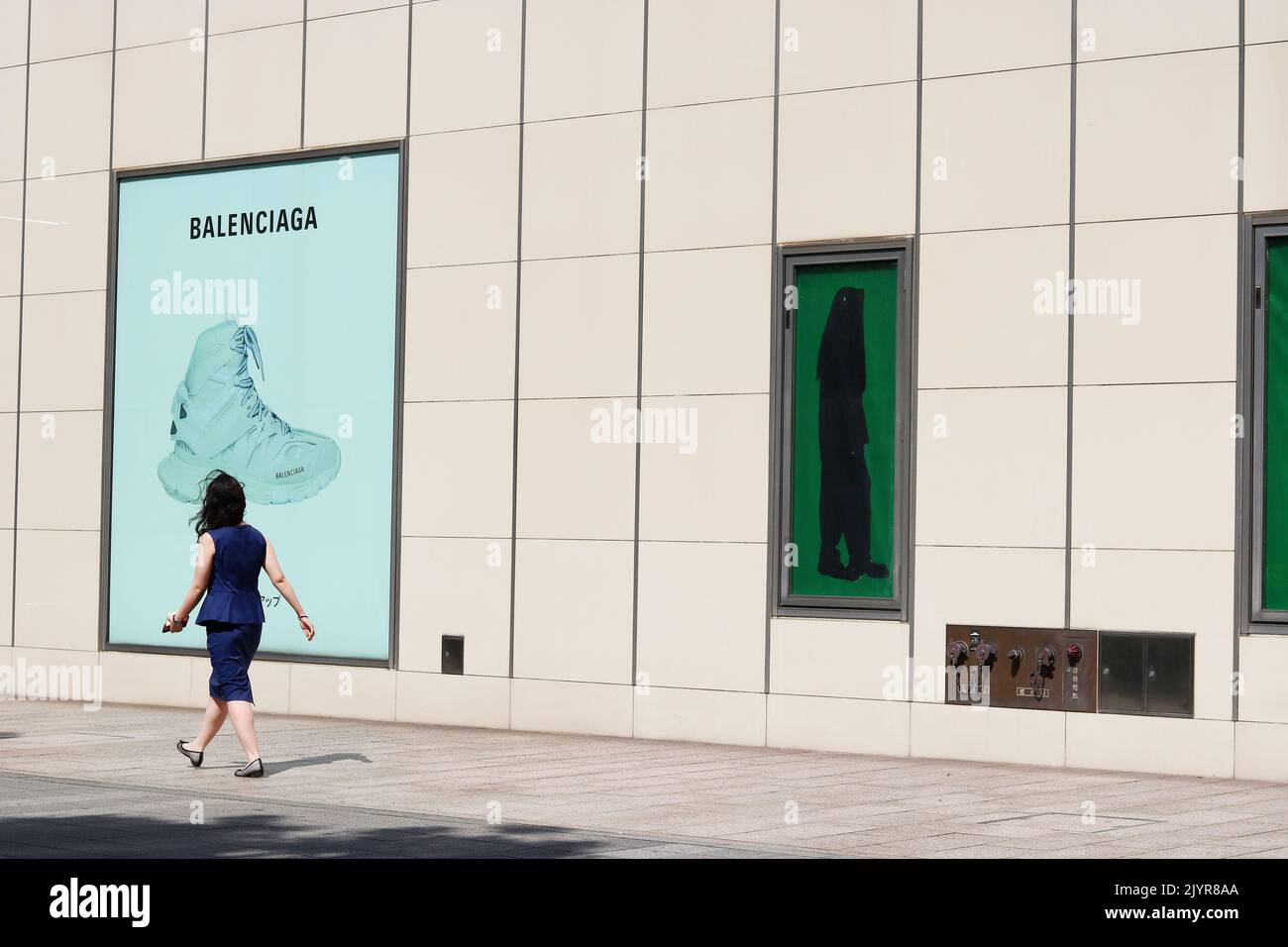 TOKYO, JAPAN - June 10, 2021: Balenciaga adverts on the wall of Lumine Yurakucho, a large multi-function building in central Tokyo. Stock Photo