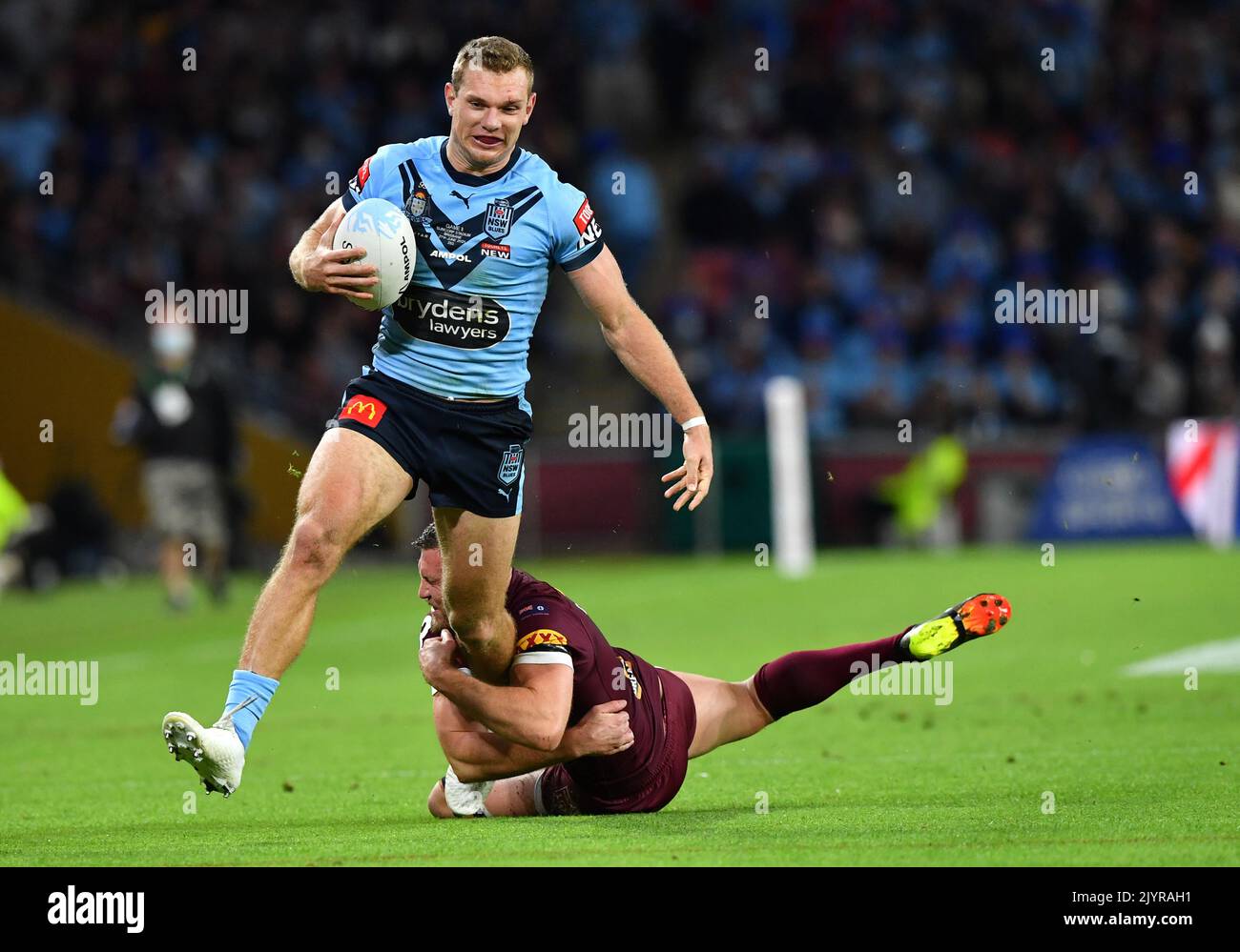 Tom Trbojevic of the Blues gets past Kurt Capewell of the Maroons