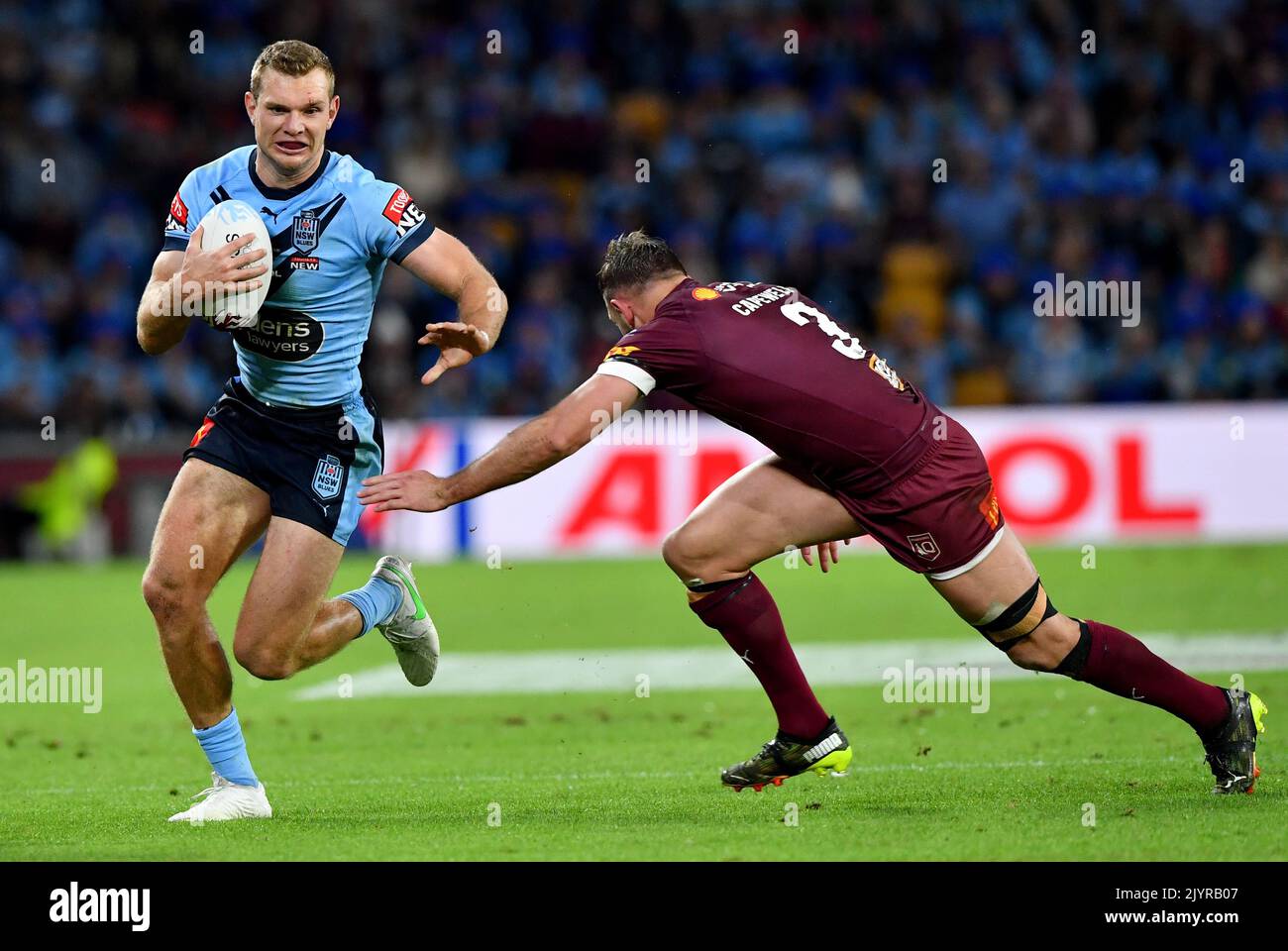 Tom Trbojevic (left) of the Blues gets past Kurt Capewell (right) of