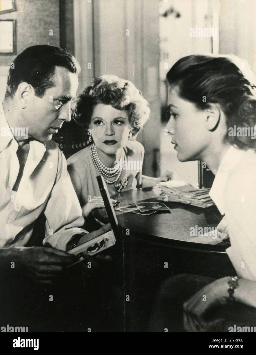 American actor Humphrey Bogart and actresses Claire Trevor and Lauren Bacall in the movie Key Largo, USA 1948 Stock Photo