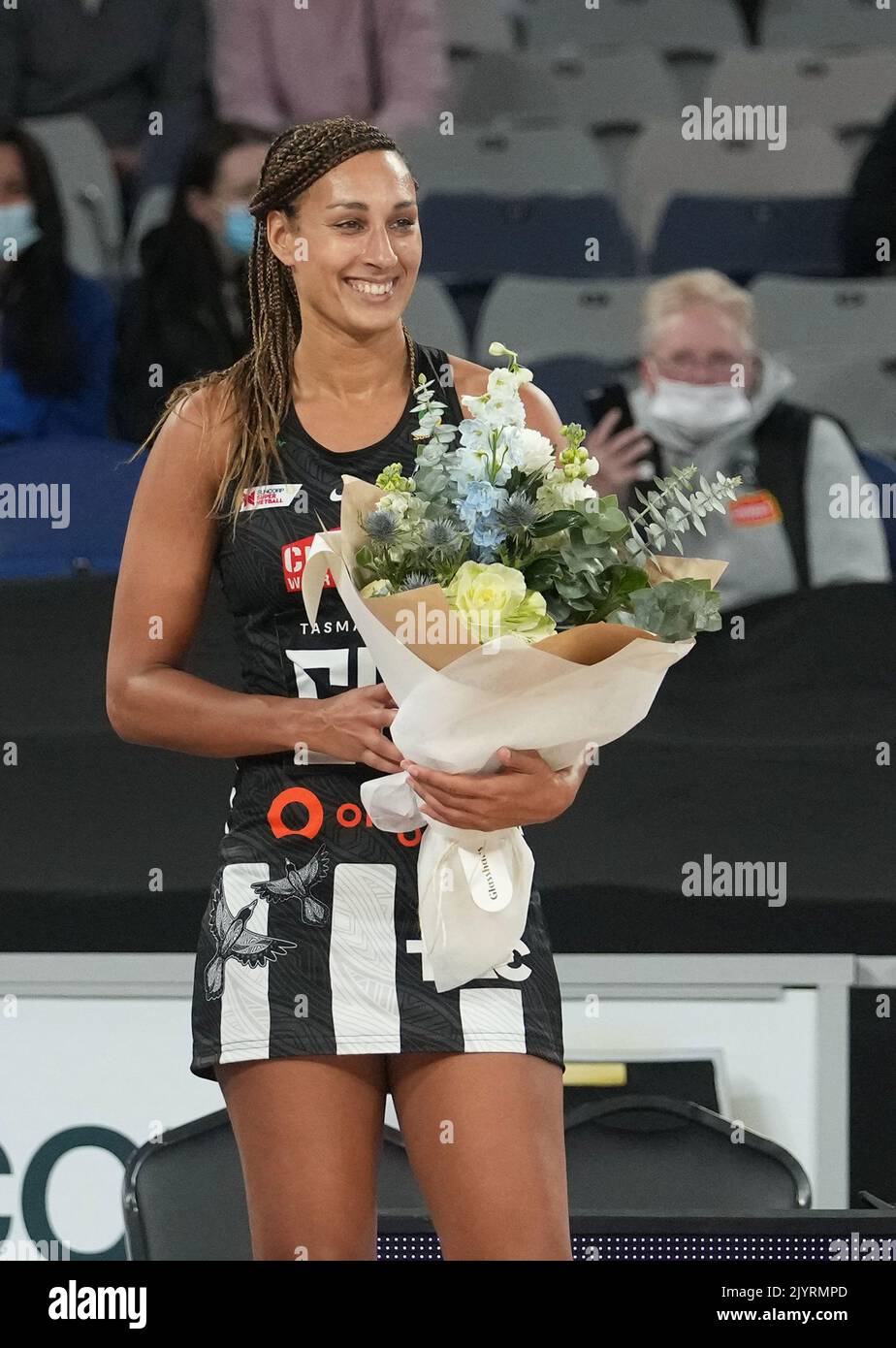 Geva Mentor of the Magpies poses during a presentation after playing her  200th game during the Round 10 Super Netball match between the Collingwood  Magpies and GWS Giants at John Cain Arena