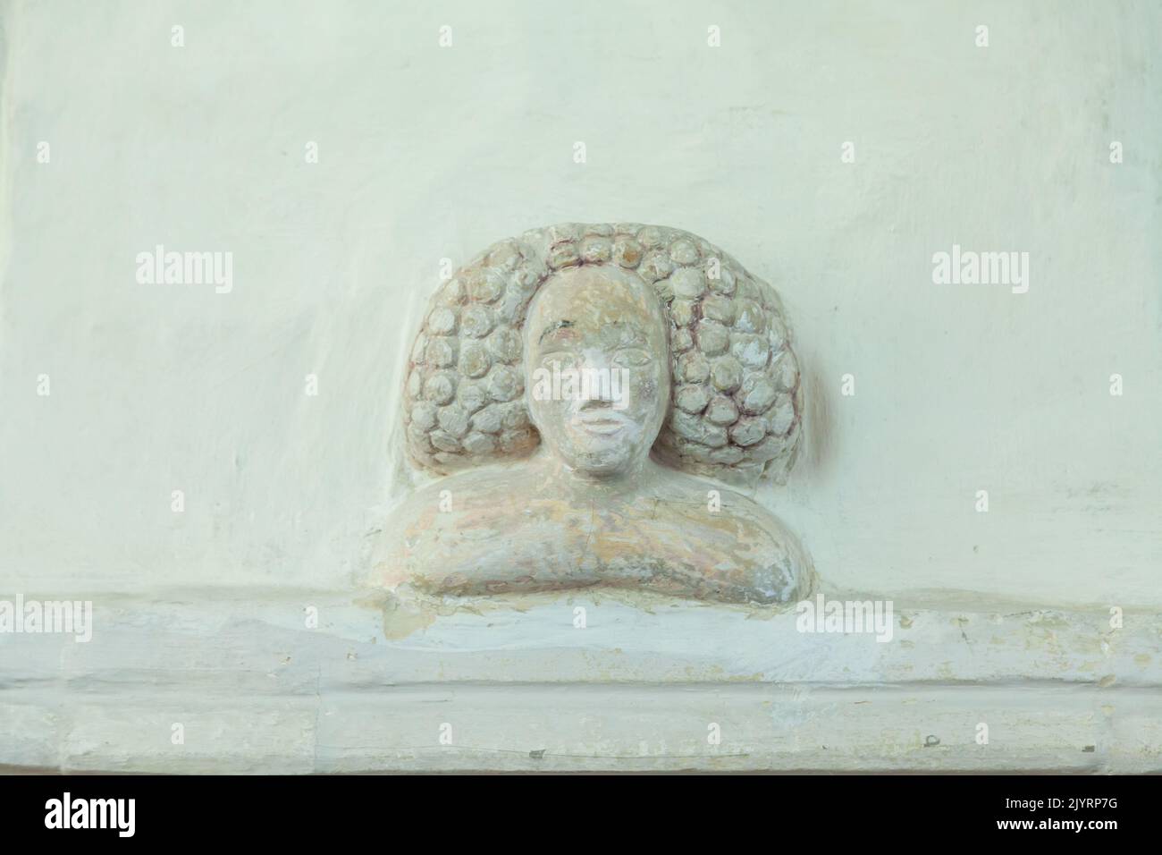 A medieval carved head and shoulders of a woman in St Andrews church, Nether Wallop, Hampshire. Stock Photo