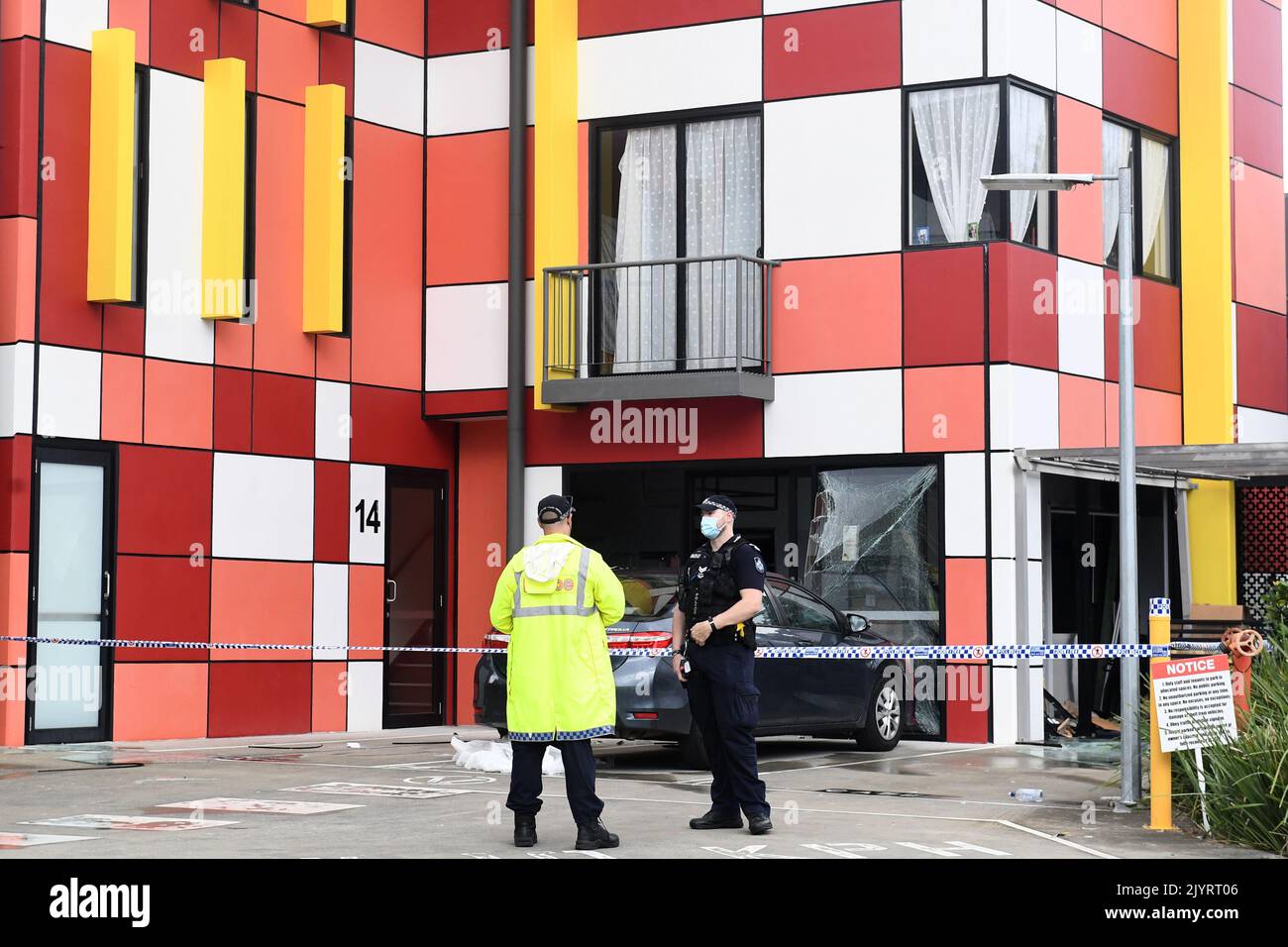 Emergency services are seen at the scene of a gas explosion at a Robina
