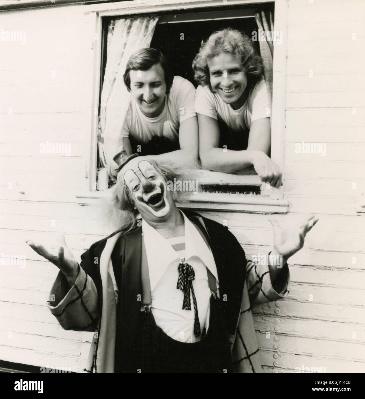 German radio and television hosts Mike Kruger and Thomas Gottschalk with Swiss clown Walter Galetti, 1990 Stock Photo