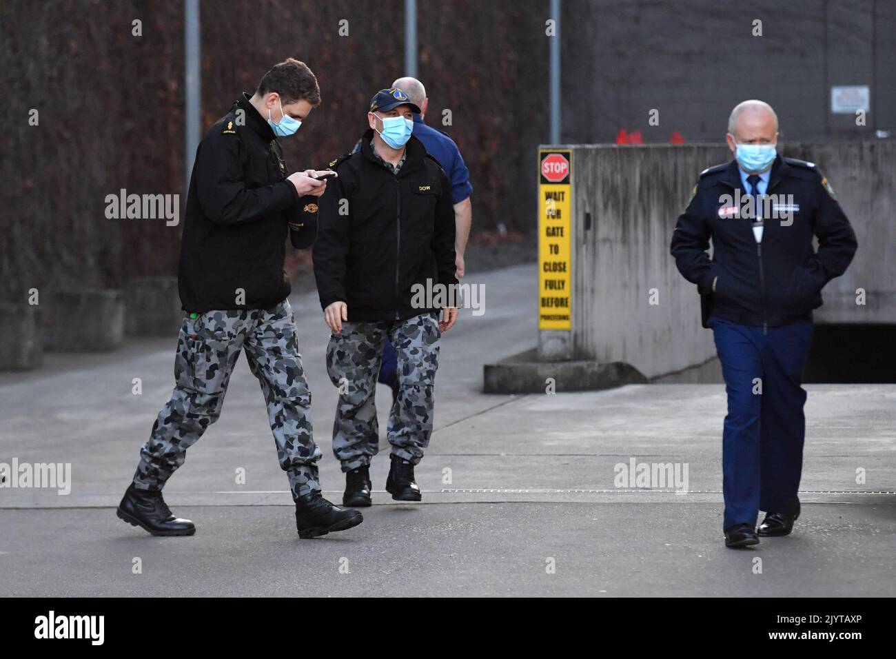 Australian Defence Force personnel and NSW police are seen at Fairfield ...