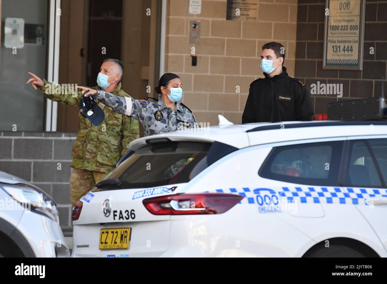 Australian Defence Force personnel are seen at Fairfield Police Station ...
