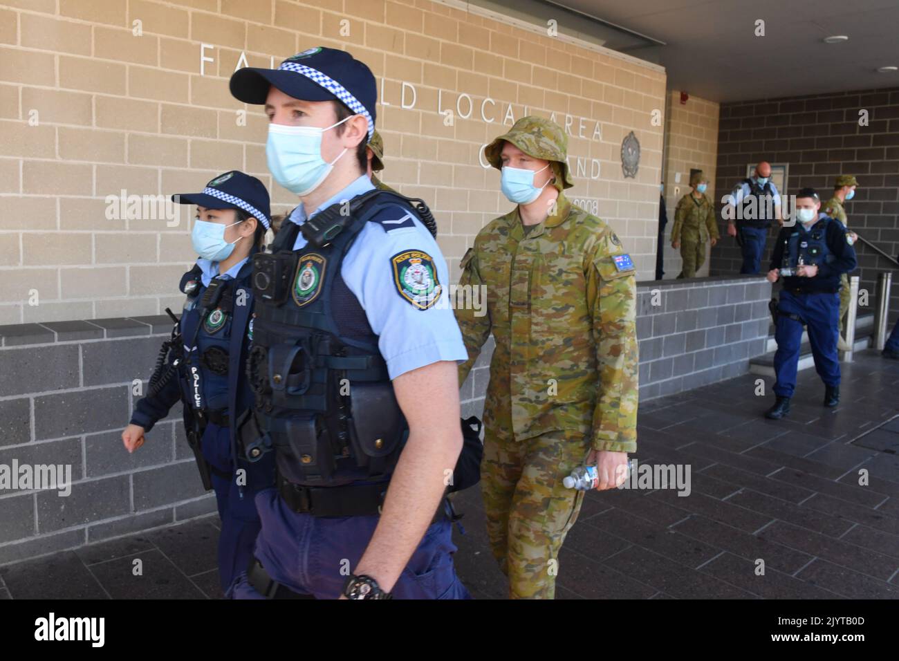 Australian Defence Force personnel and NSW police are seen being ...