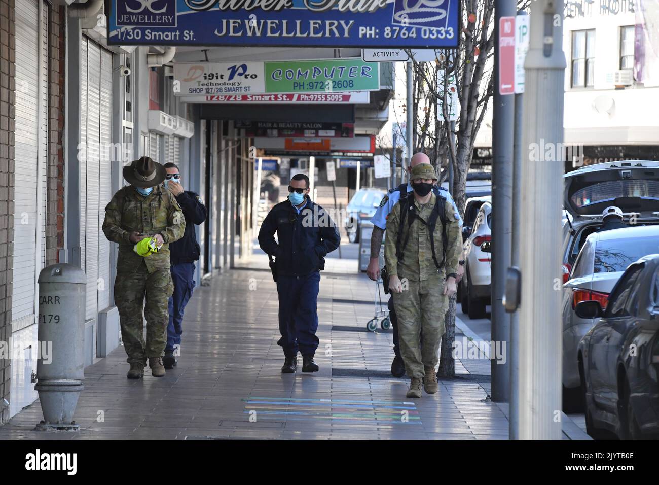 Australian Defence Force personnel and NSW police are seen at Fairfield ...