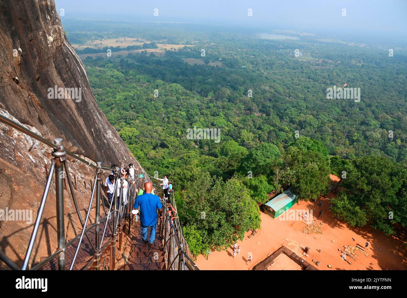 Tourists on the staircase going to the summit of the Lion's rock, former capitale of king Kasyapa from 477 to 495. Sirigiya. Sri-Lanka. Stock Photo