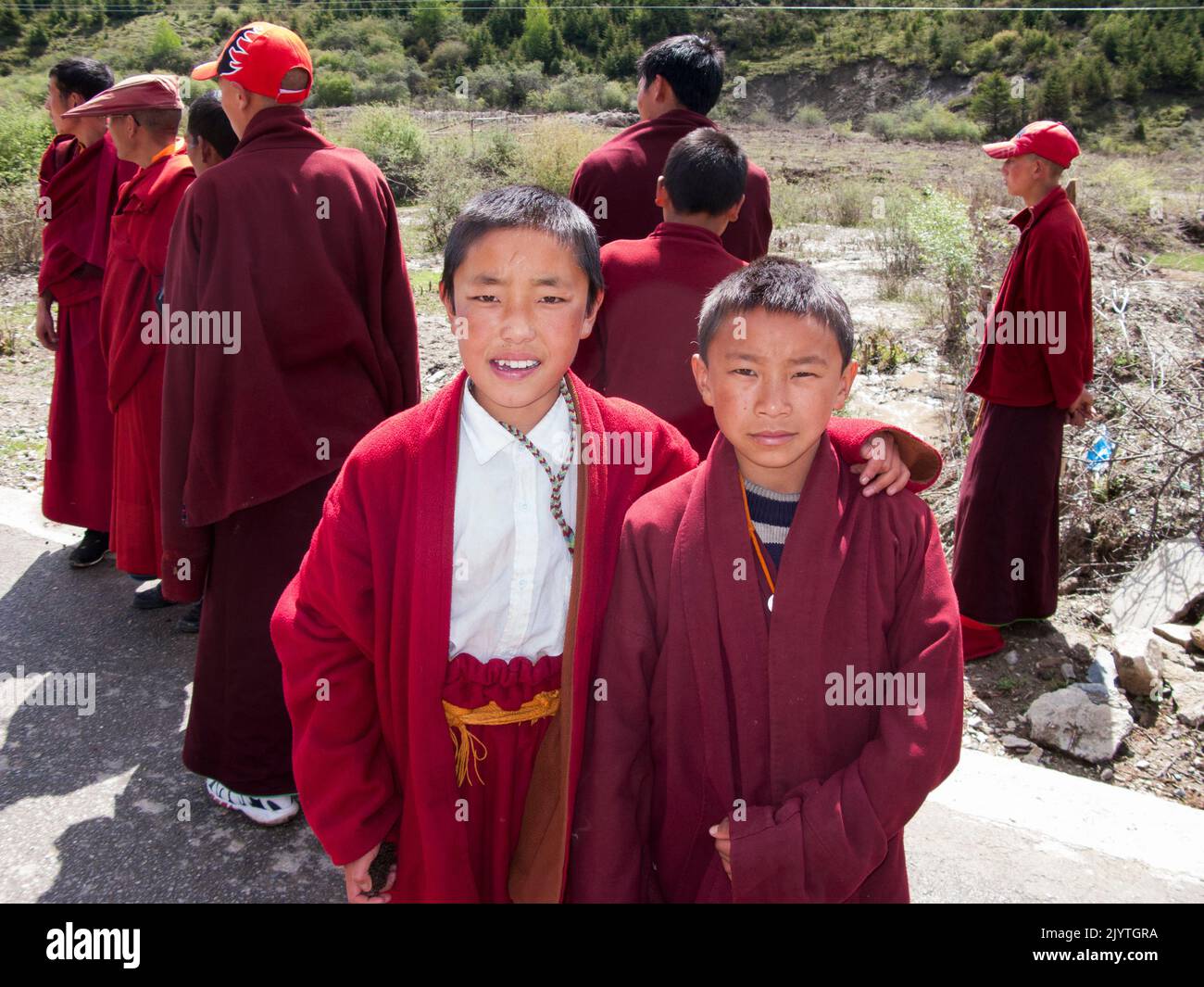 Boys boy monk / novice monks in a small Tibetan village outside Songpan ancient town in northern Sichuan (Chinese) province, China. PRC. Administered by Ngawa Tibetan and Qiang Autonomous Prefecture. (126) Stock Photo