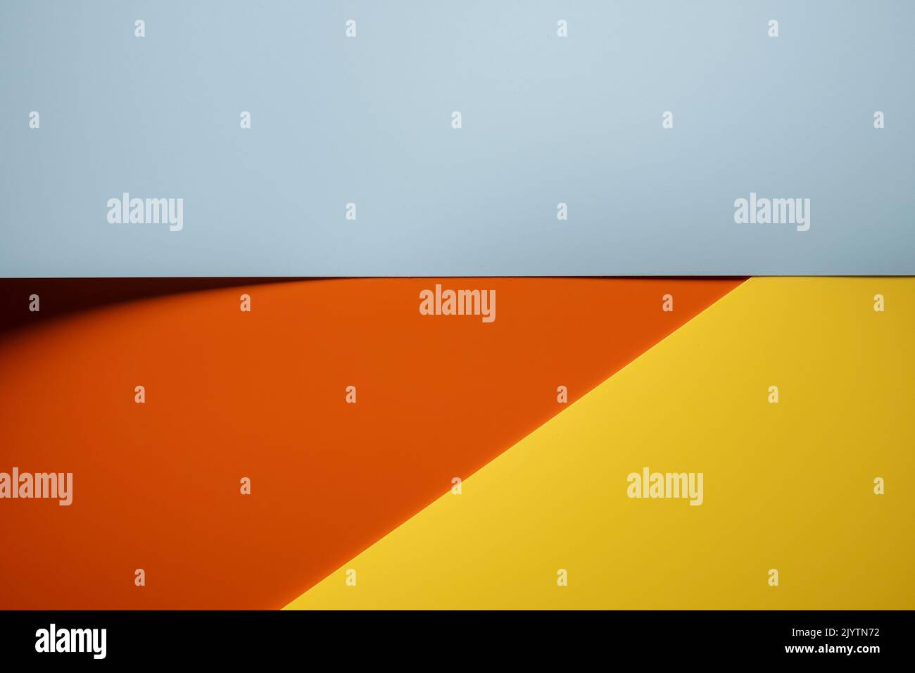Abstract background of gray, red and yellow colors with shadow. Copy space. Top view.  Stock Photo