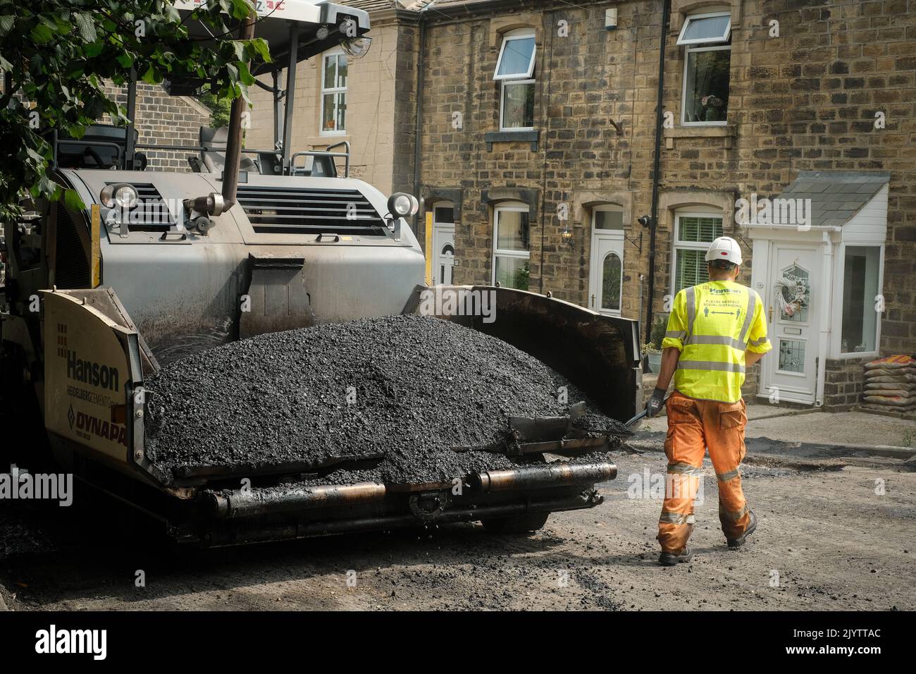 Oakworth, West Yorkshire, UK. Resurfacing the roads Stock Photo