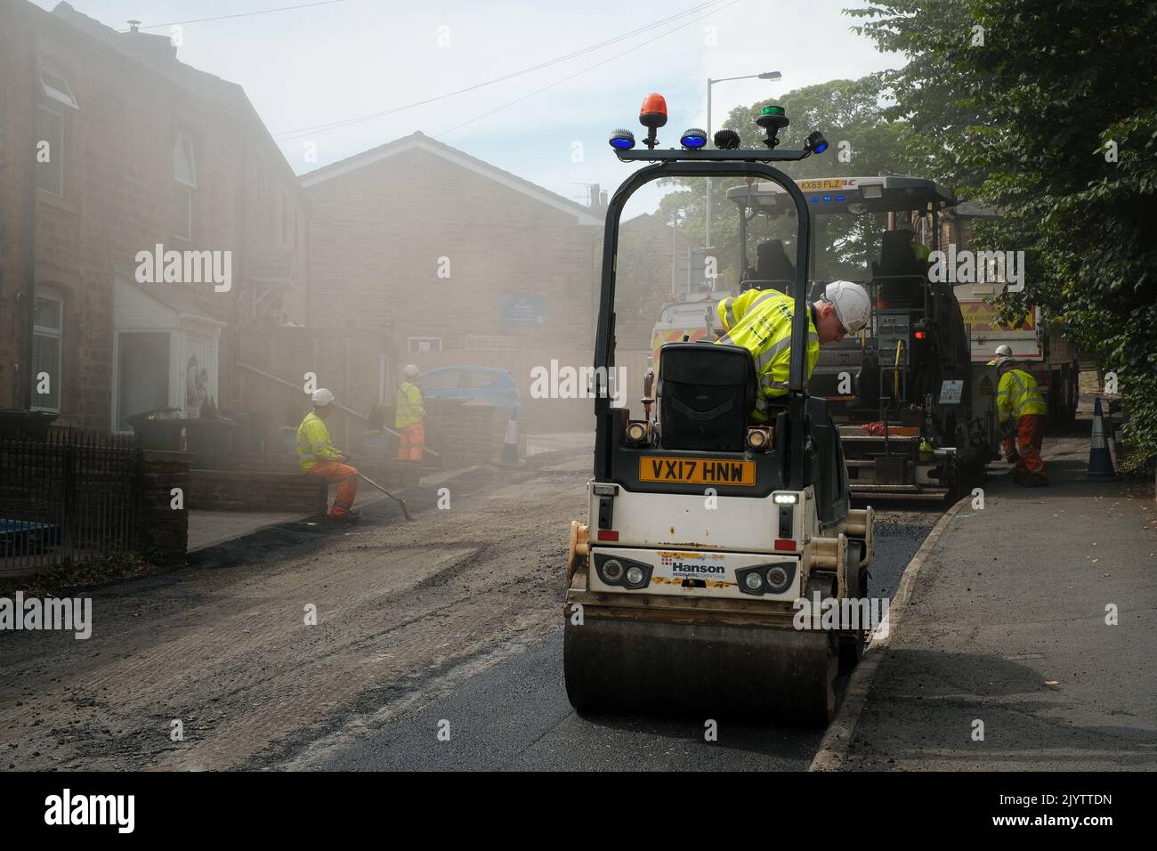 Oakworth, West Yorkshire, UK. Resurfacing the roads Stock Photo