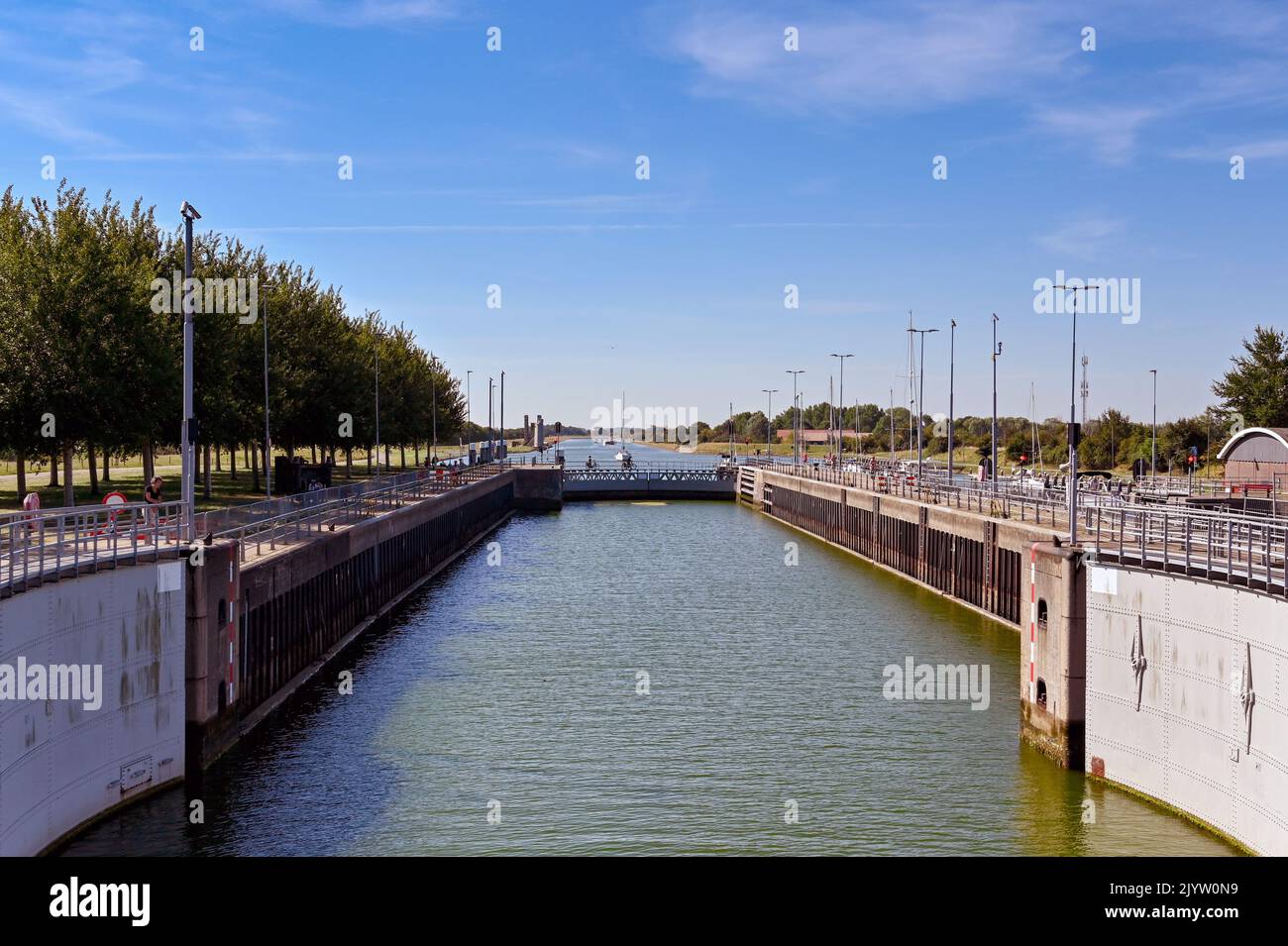 Veere, Netherlands - August 2022: Entrance to the canal lock near the town with lock gates open Stock Photo