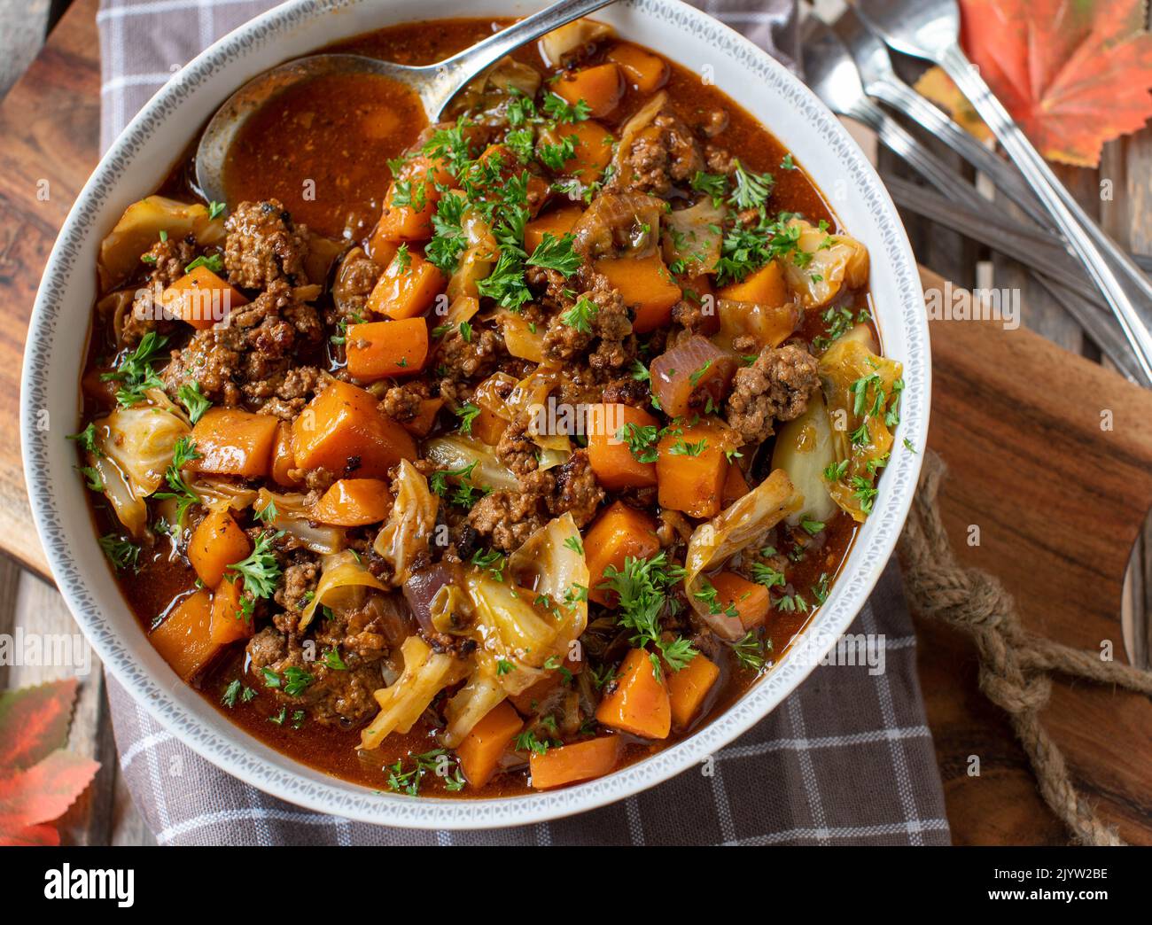 Minced meat stew with cabbage and carrots in bowl Stock Photo