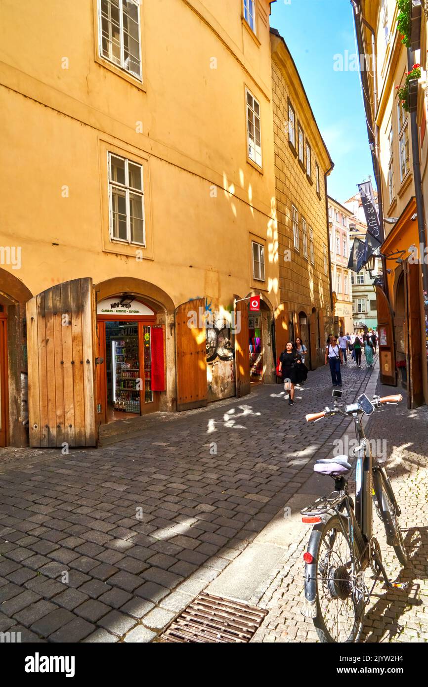 Prague, Czechia, August 29, 2022: Parked bicycle in a narrow pitoresque alley in Prague Old Town, bicycle tour Prague and Czech Republic Stock Photo