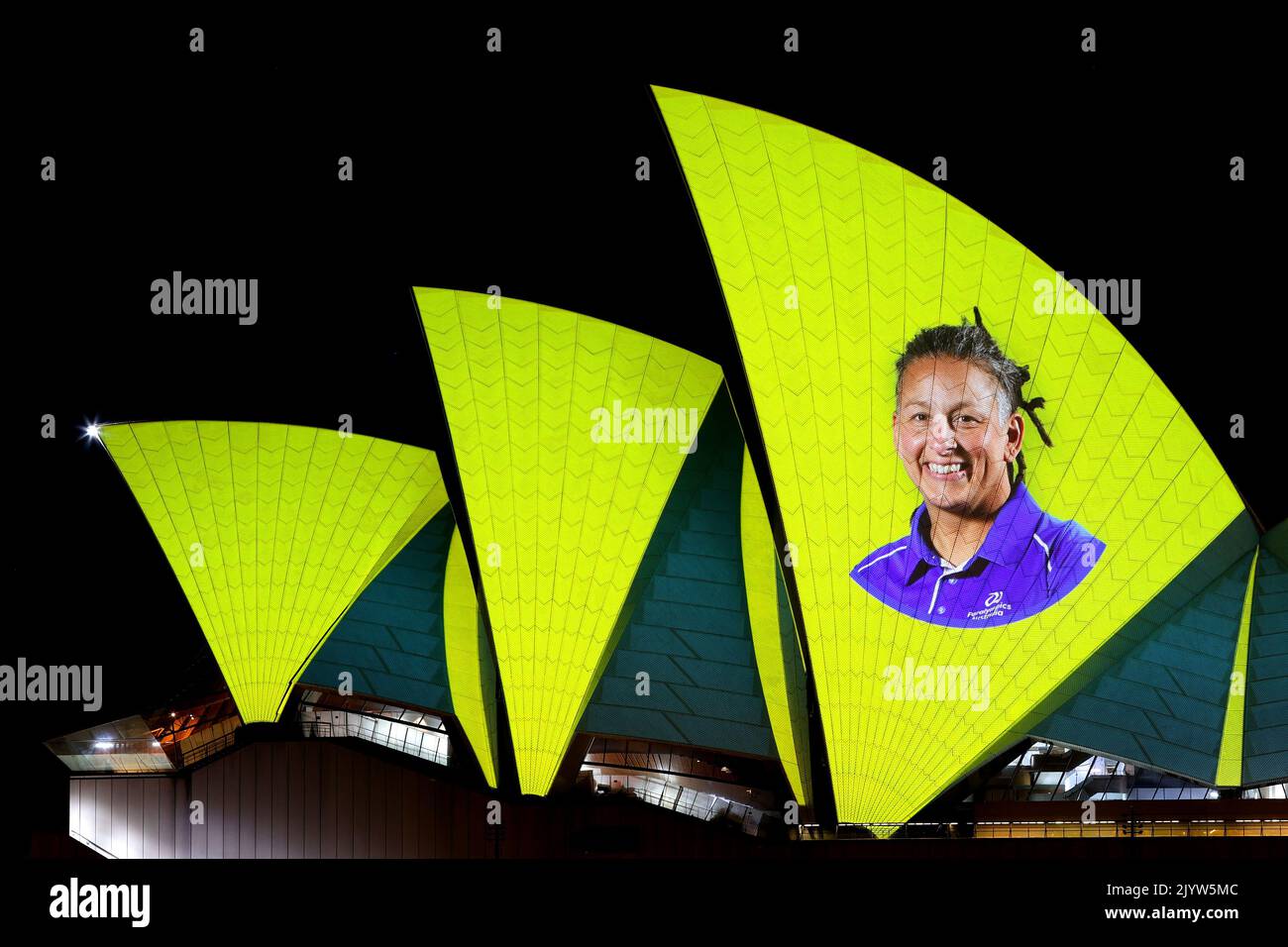 Images of Australian Olympians and Paralympians are projected onto the ...