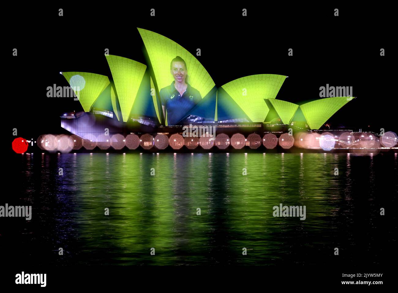 Images of Australian Olympians and Paralympians are projected onto the ...