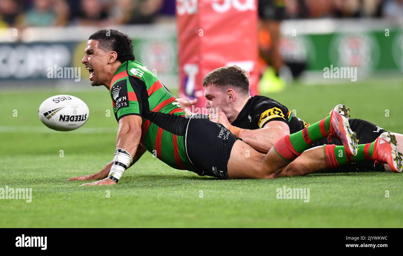 Cody Walker (left) of the Rabbitohs scores a try during the NRL Grand