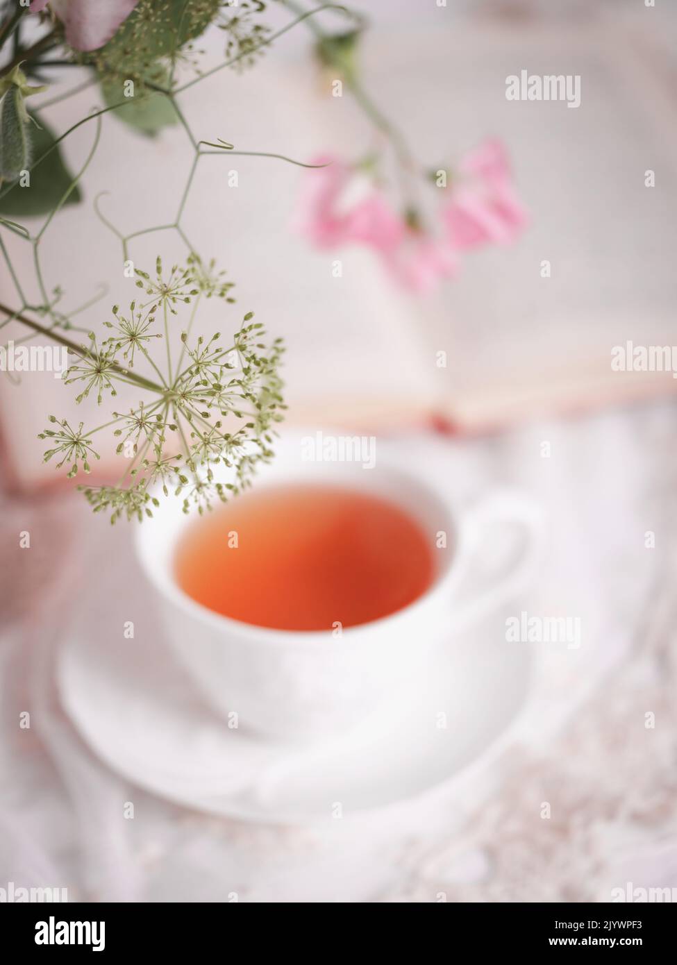 White tea cup with flowers Stock Photo Alamy