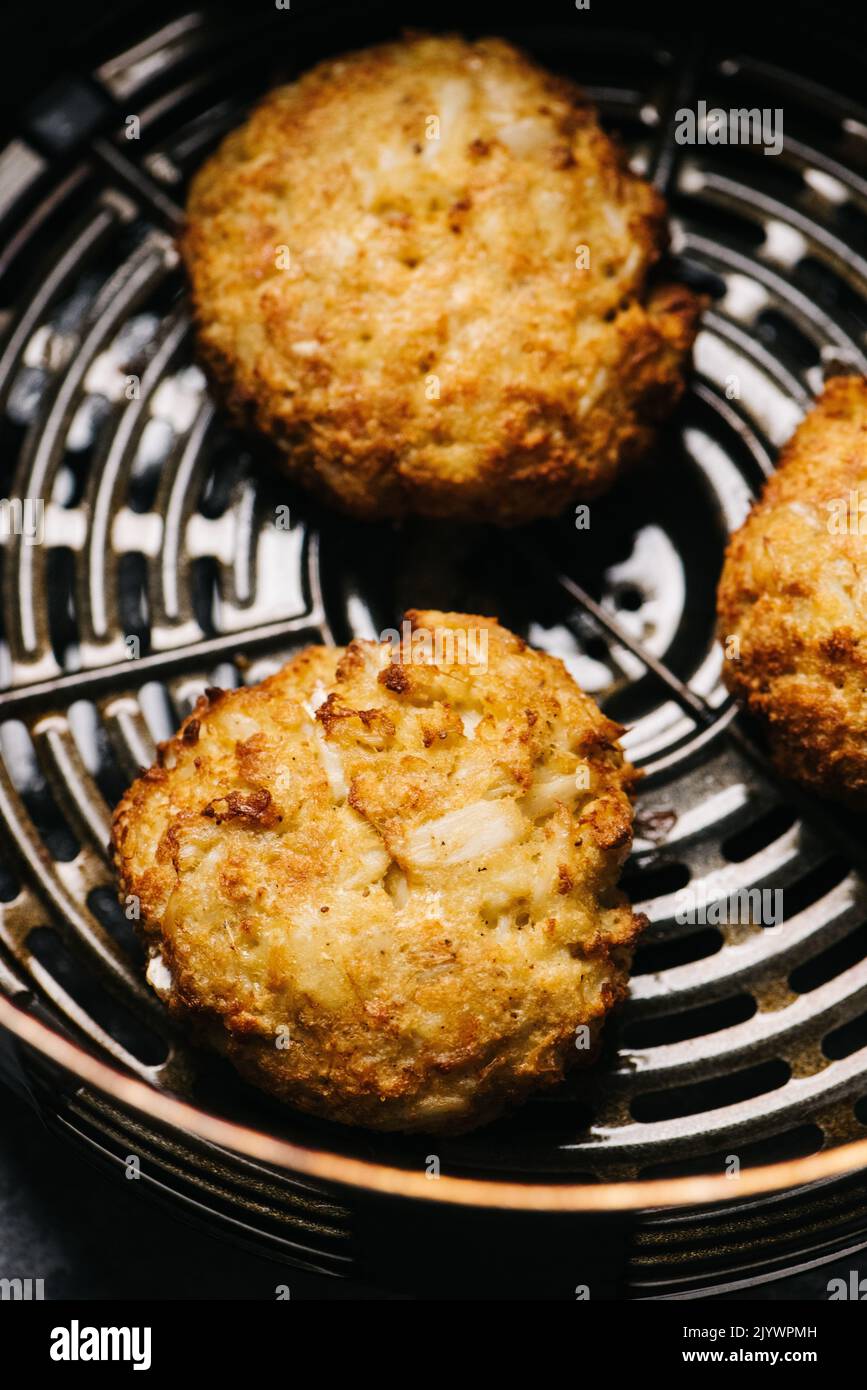 Crab Cakes in an air fryer Stock Photo Alamy