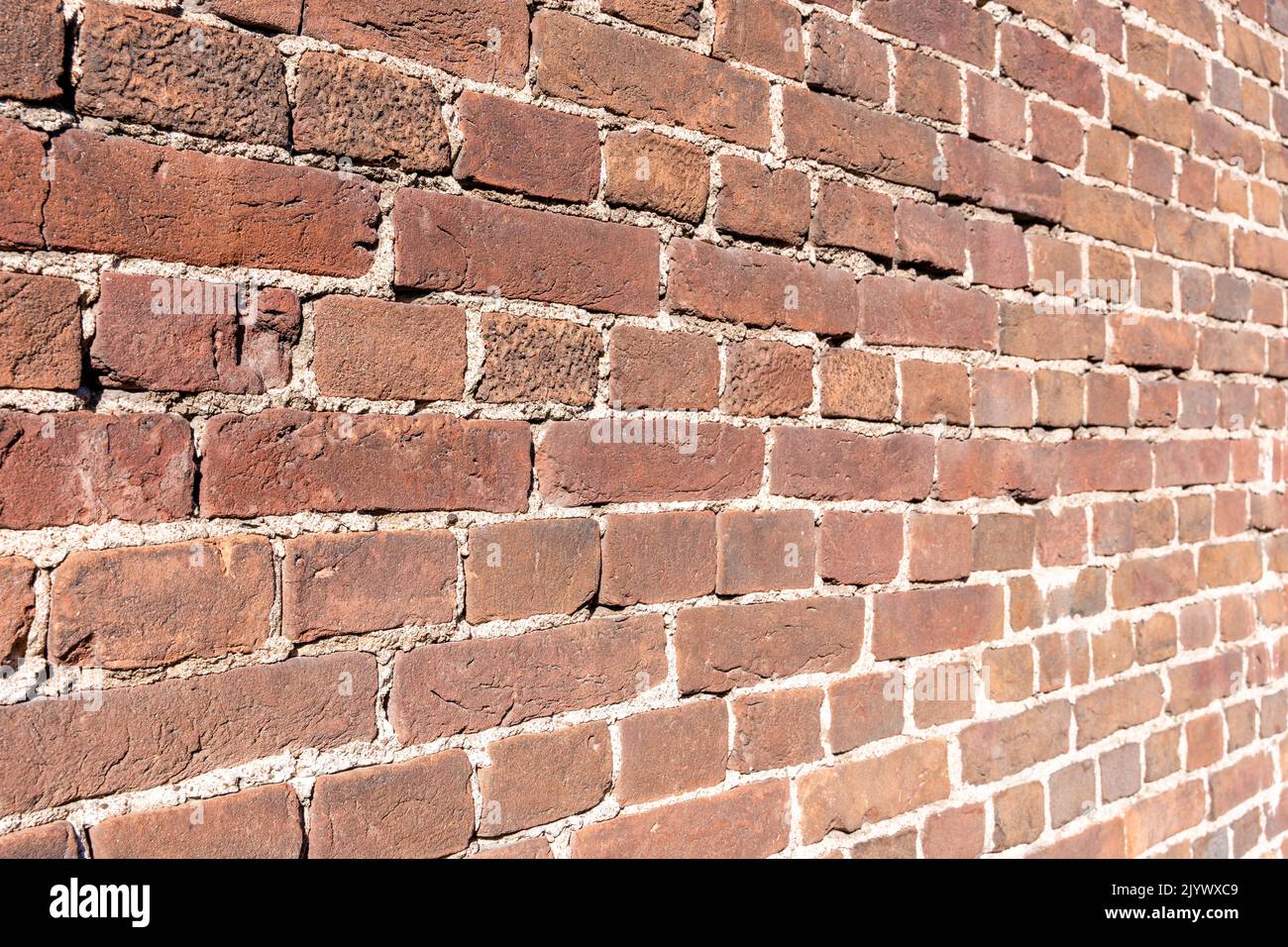 The texture background brick wall made of old red brick Stock Photo