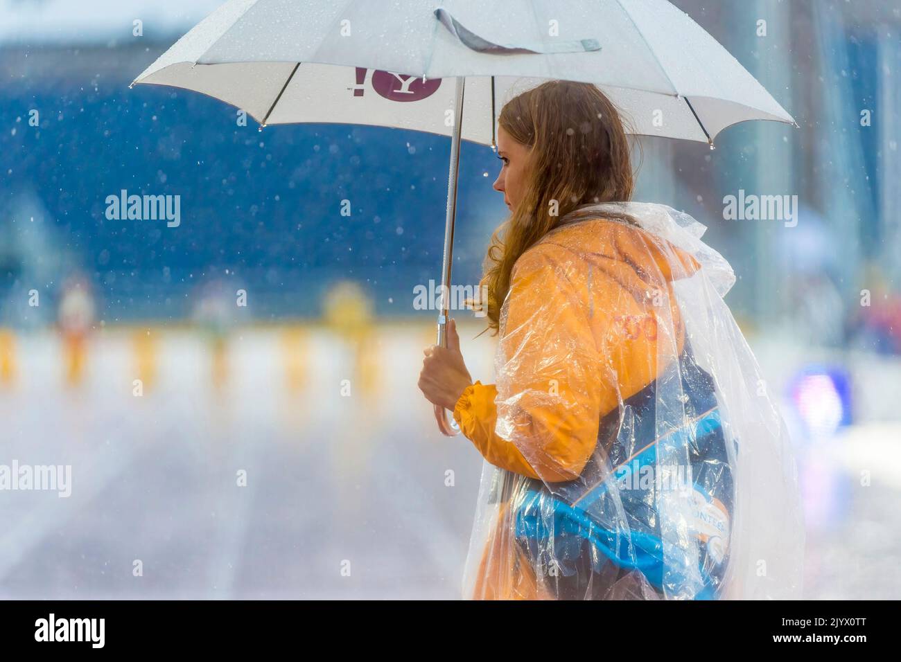 Volunteer woman in rainy weather during the Toronto Pan American Games 2015 Stock Photo