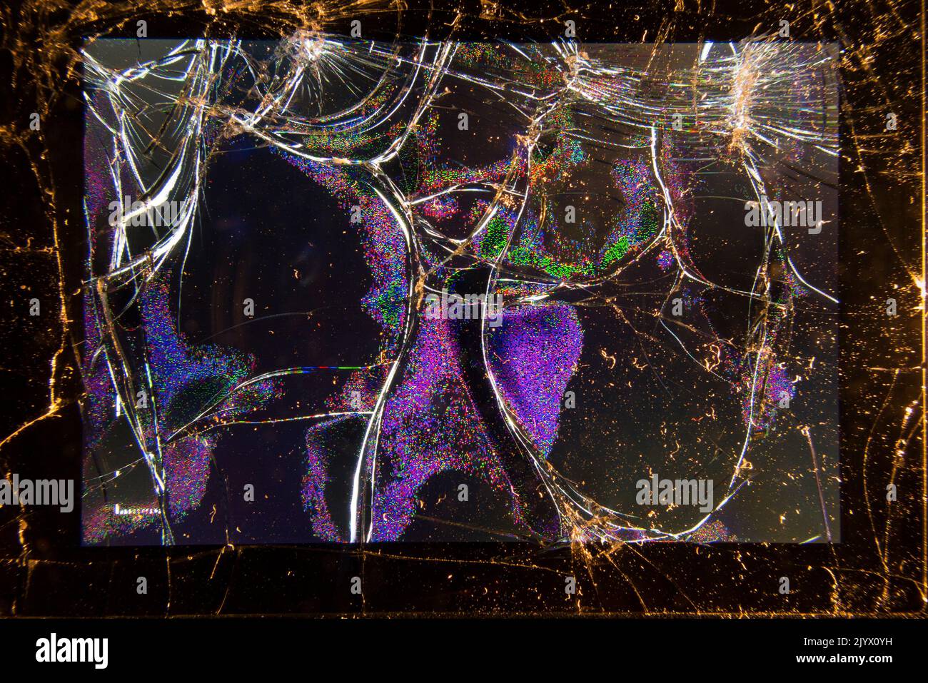 Broken and shattered LCD screen on the rear of a compact photographic